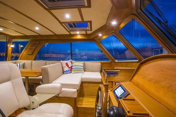 Interior of the 2027 Sabre 38 Salon Express with elegant wood accents and large windows.