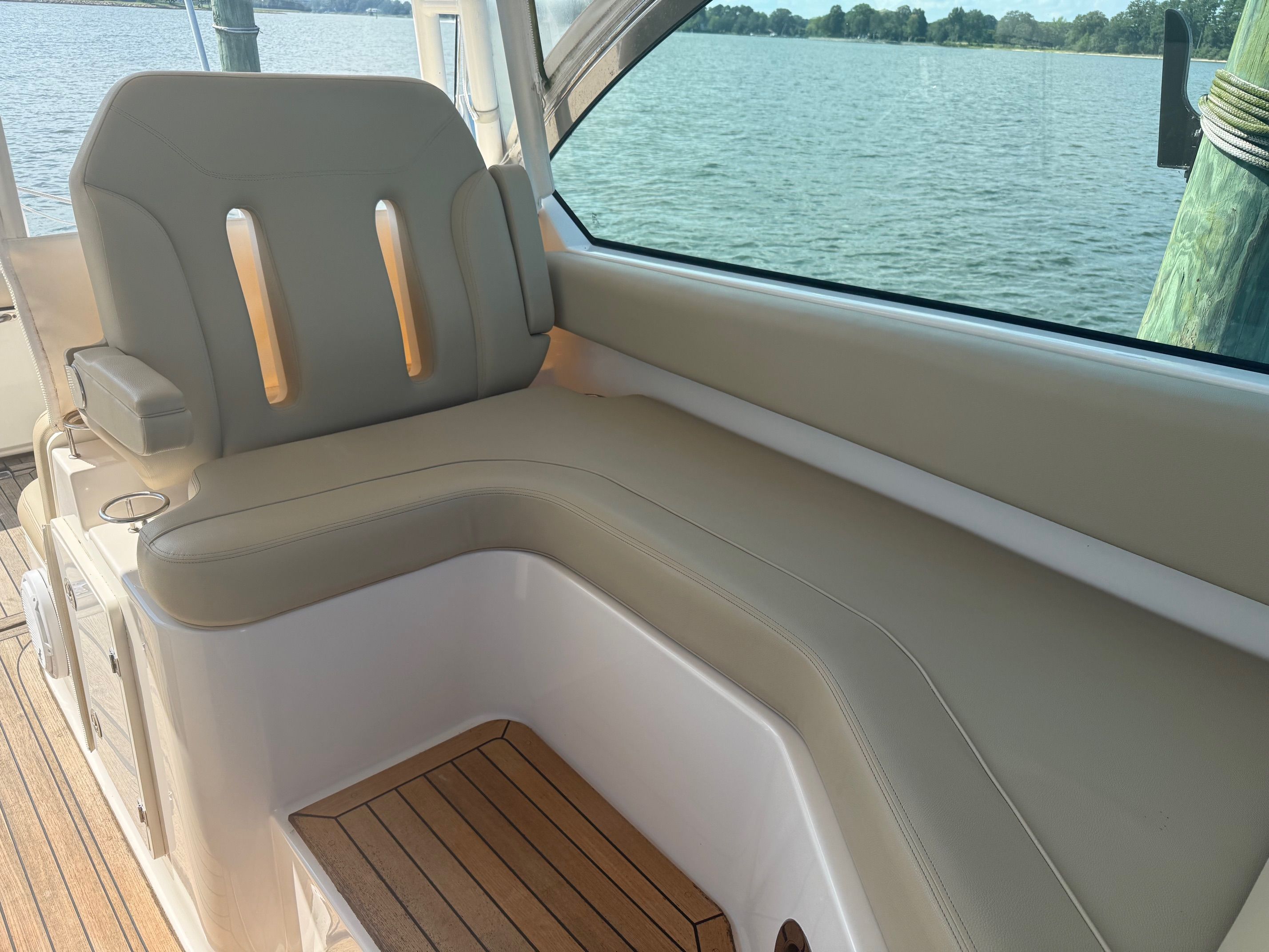 The 2016 Pursuit DC 325 Dual Console features a comfortable seating area overlooking the water.