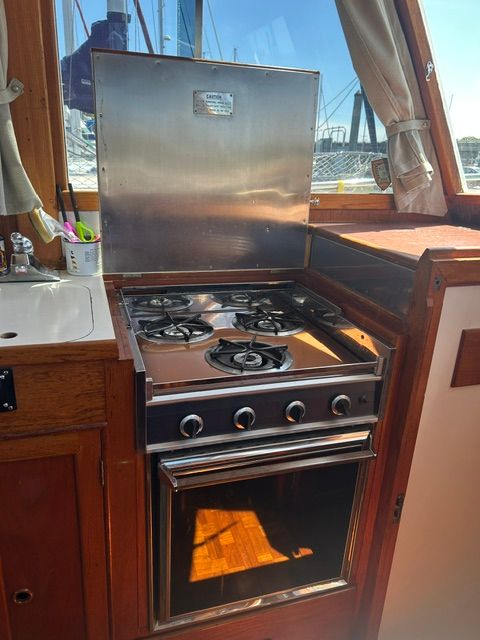 Kitchen on a 1980 Grand Banks 32 Sedan boat.