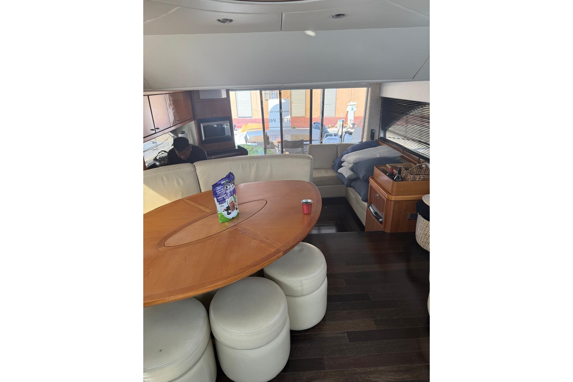 Interior of 2007 Sunseeker Manhattan 66 yacht with modern furnishings and dining area.