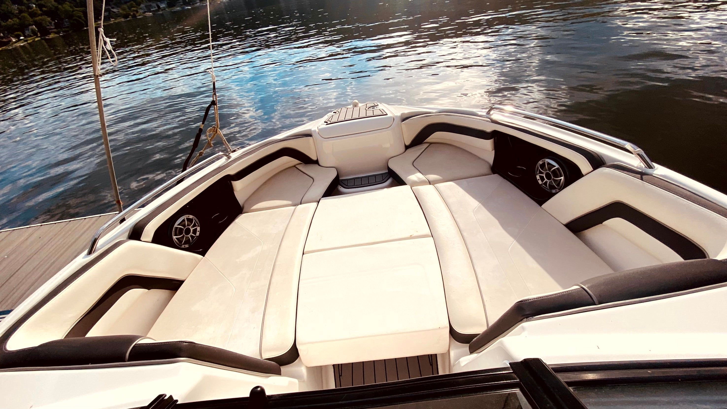 Interior of a 2016 Yamaha AR240 boat with luxurious seating.