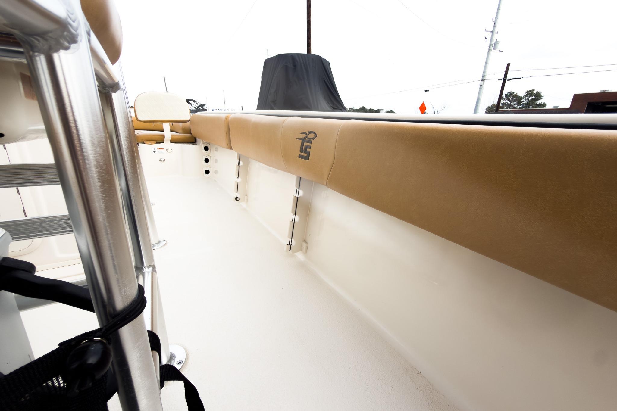 2025 Carolina Skiff 21 Ultra Elite interior with tan seating and stainless steel details.