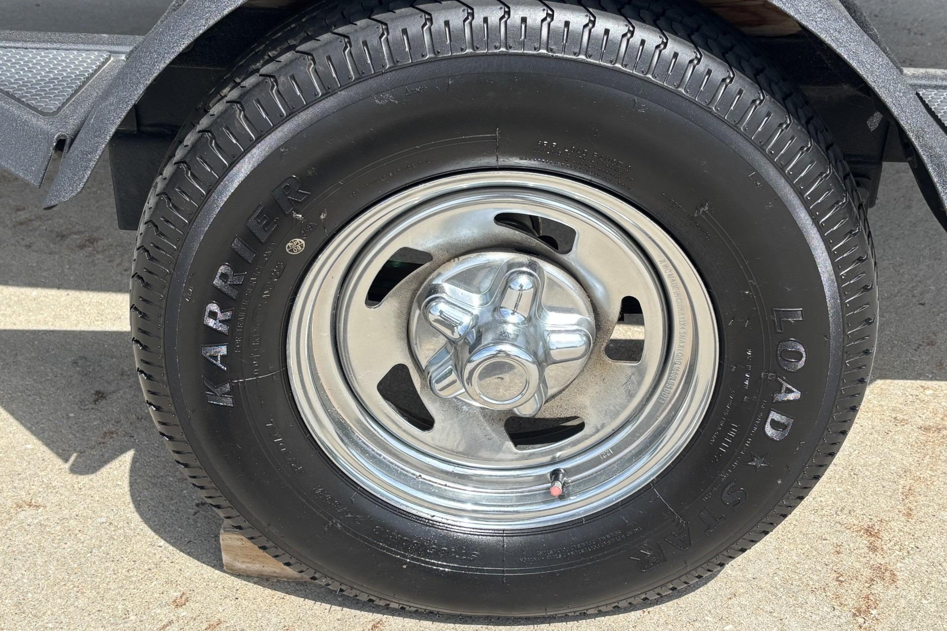 Trailer tire and wheel of 2024 Tracker Pro Team 175 TF boat.