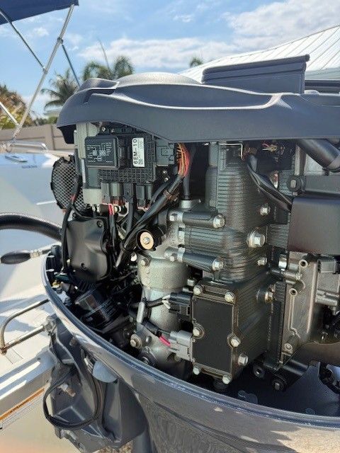 Engine of a 2020 Nautic 203SC boat in sunny weather.