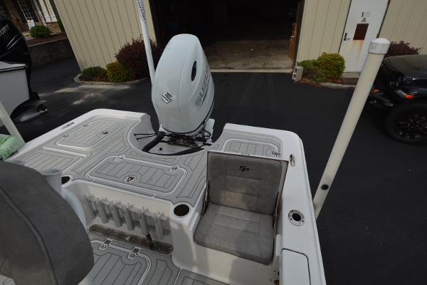 2021 Sea Pro 228 Bay boat with Suzuki outboard motor and cushioned seating.