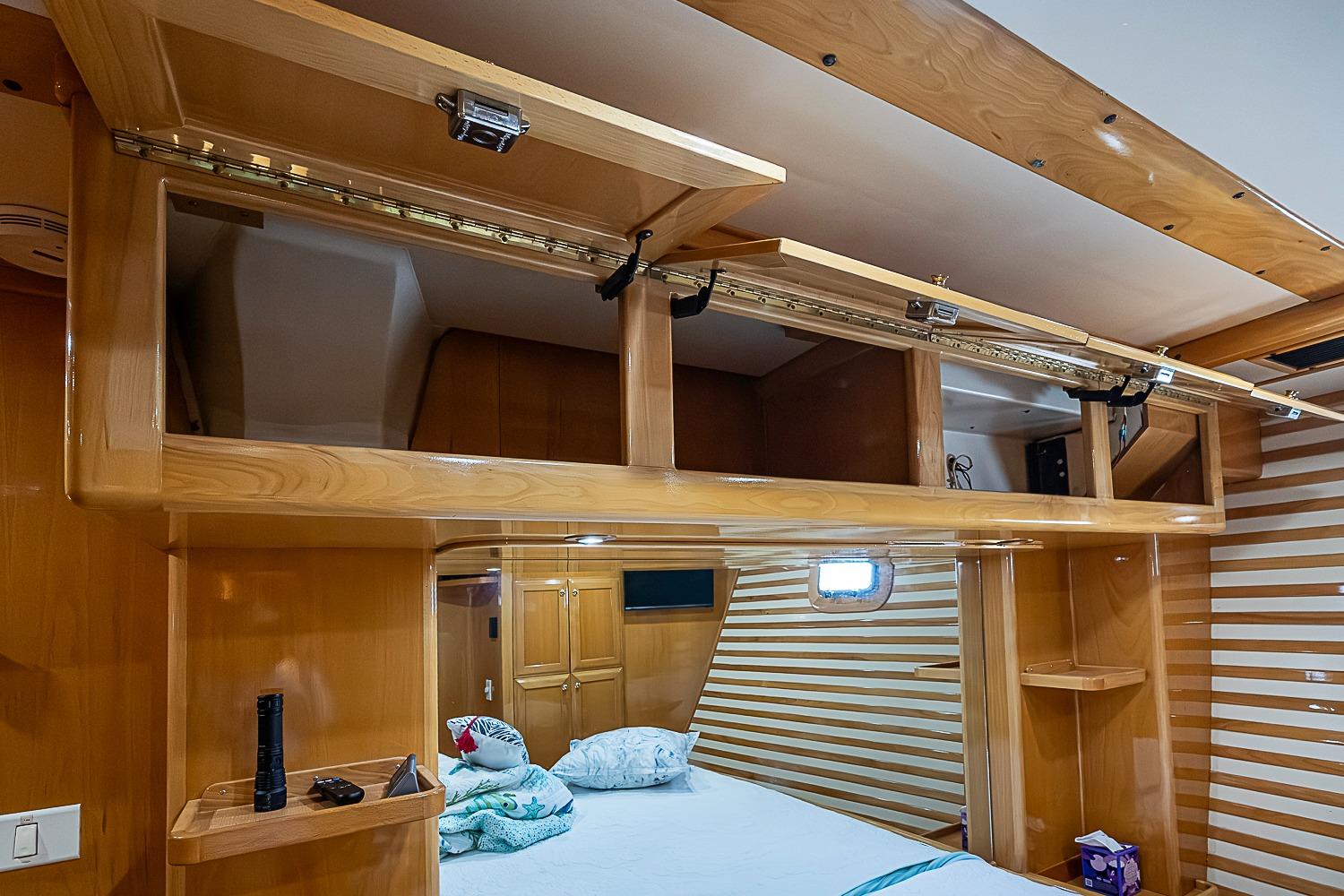 Luxurious wooden interior of 2003 Magna Marine Nova Scotia 47 yacht cabin.