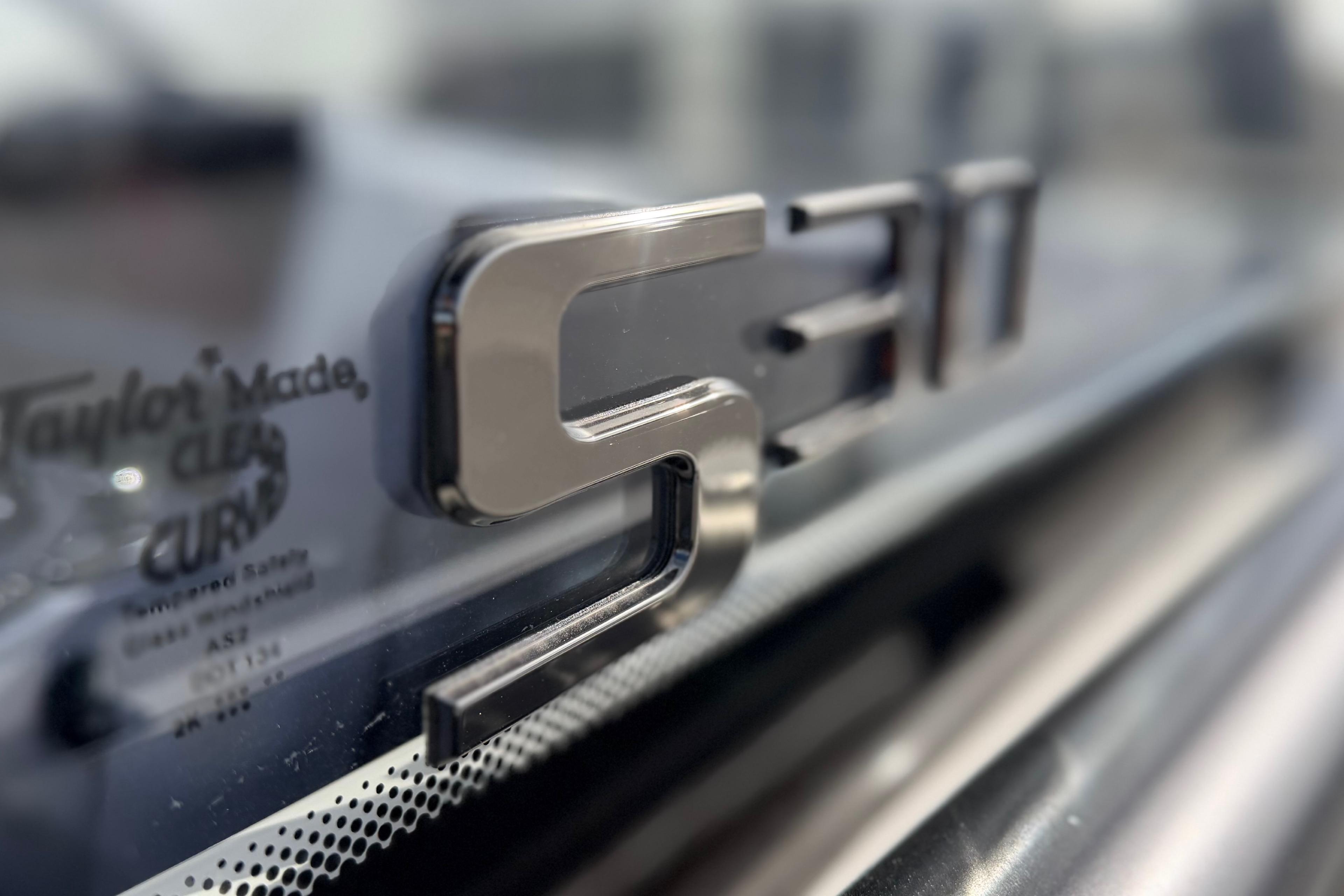 Close-up of 2026 Navan S30 logo on a reflective surface.