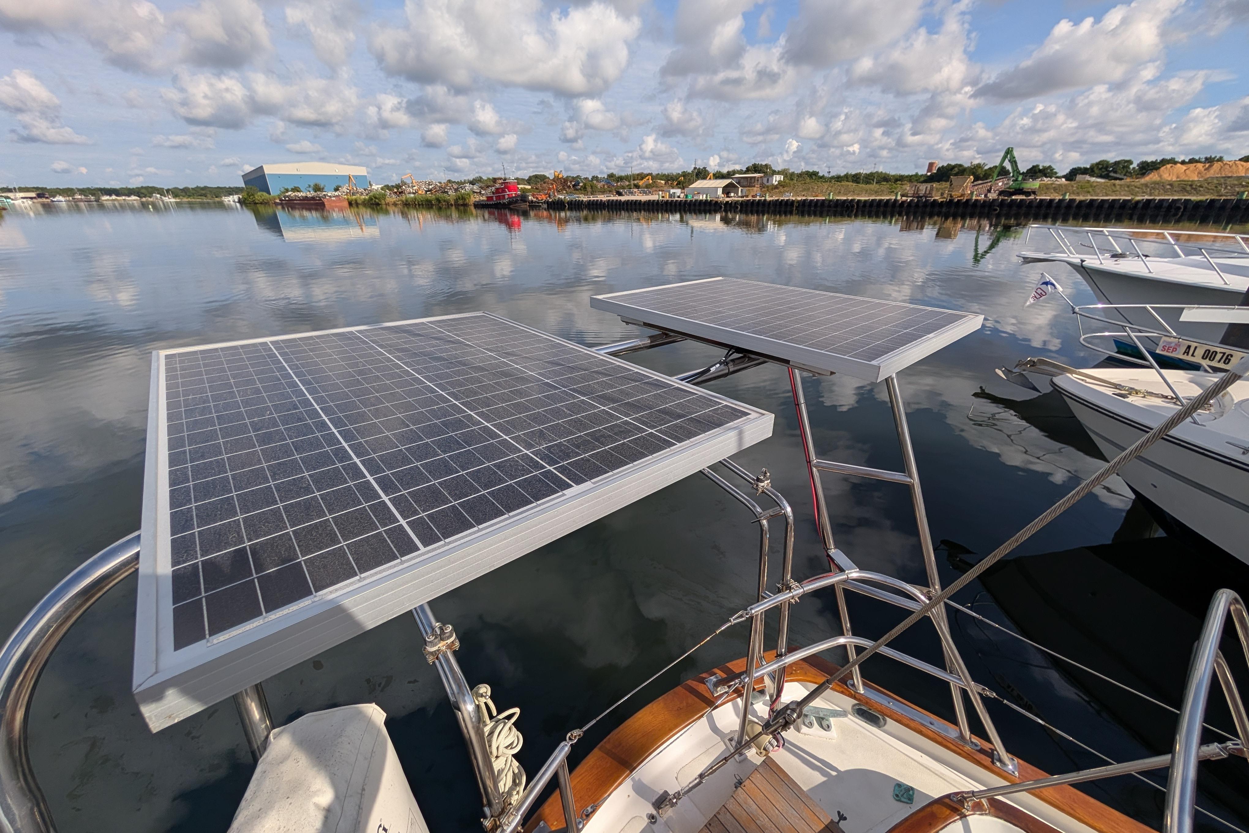 Sailboat with solar panels on calm water, Robert Perry 41, 1983 model.