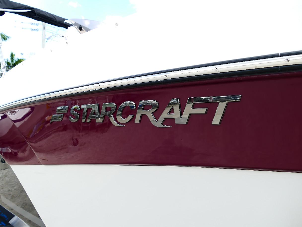 2026 Starcraft SVX 231 OB boat logo on maroon and white hull.