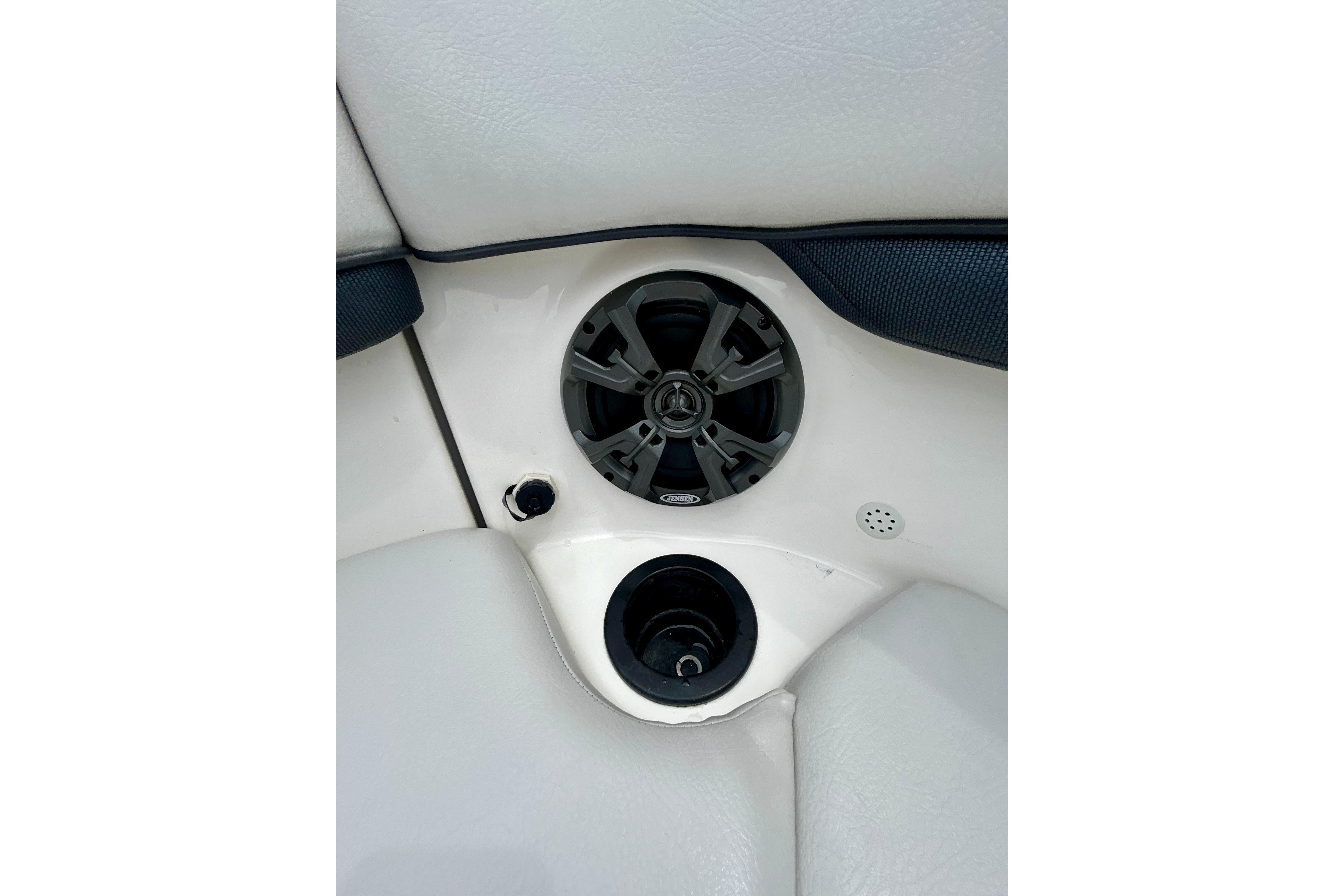 Speaker and cup holder on 2015 Yamaha AR210 boat interior.