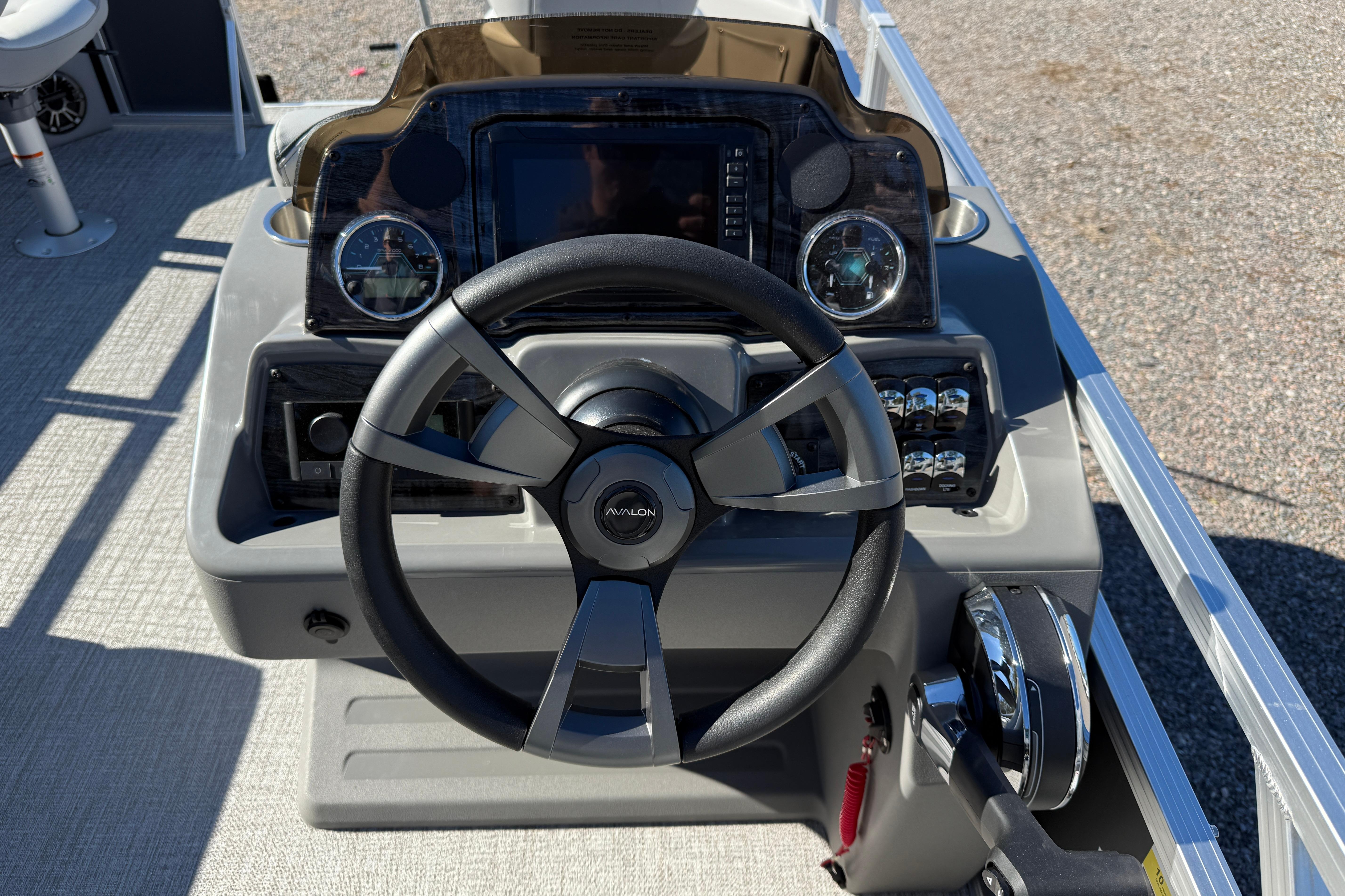 Steering console of 2026 Avalon VENTURE 85 QUAD boat with modern controls.