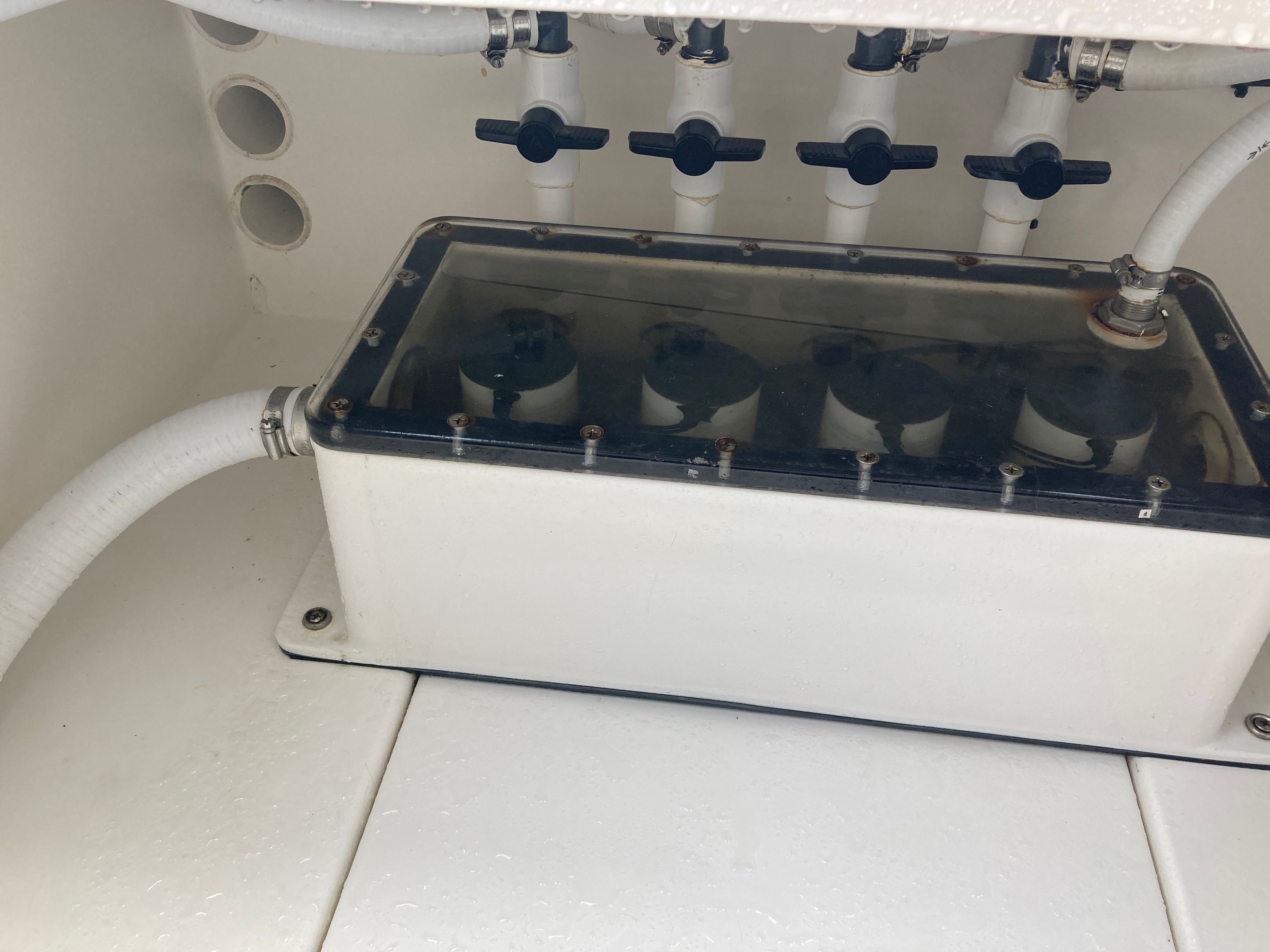 Venture CC 2019 boat system with valves and hoses.