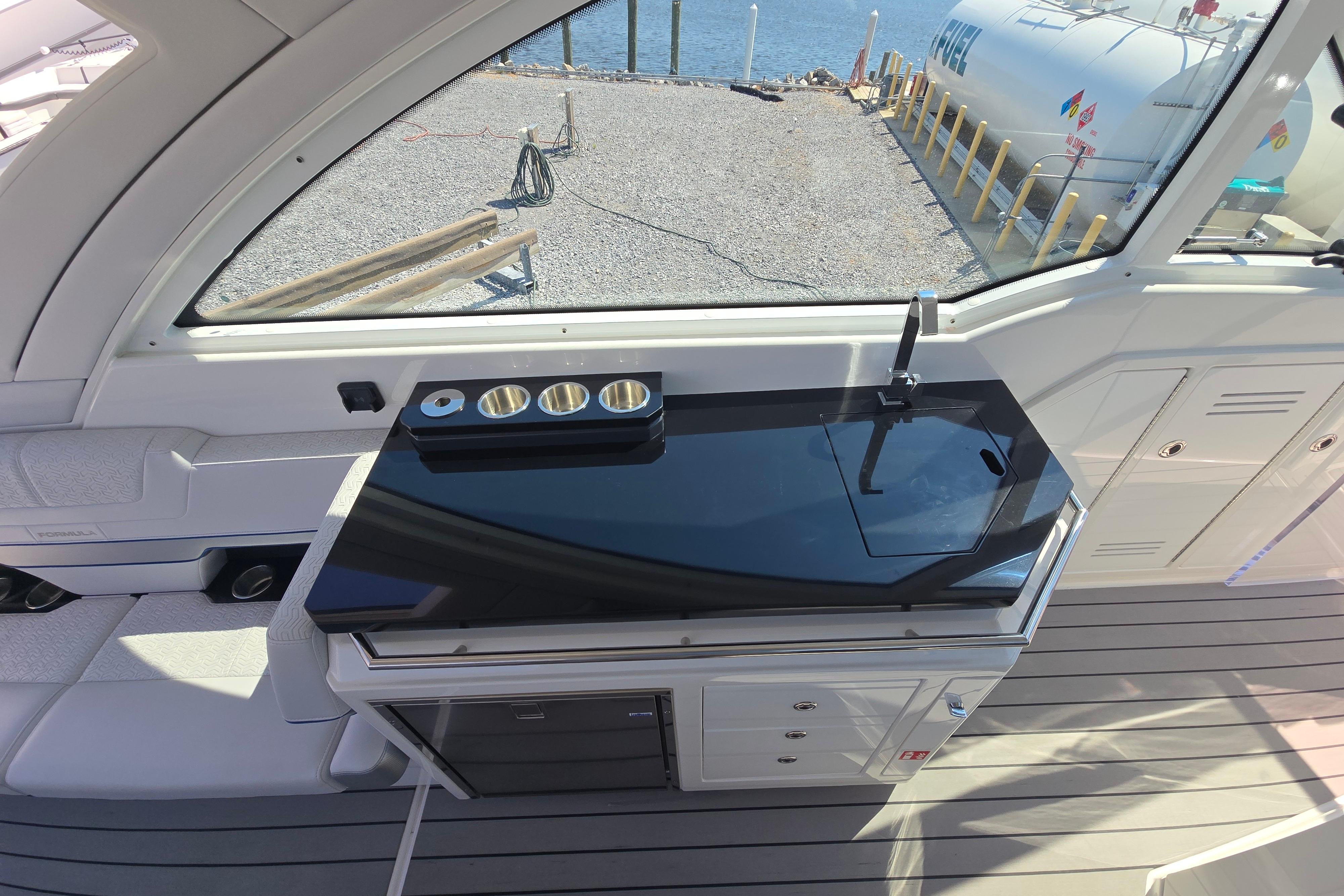 Interior of 2025 Formula 380 Super Sport Crossover OB with sleek kitchenette and modern design.