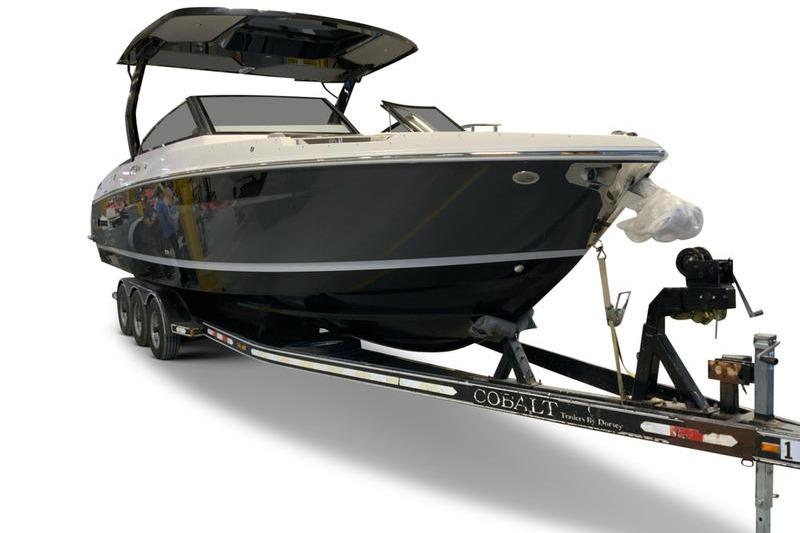 2026 Cobalt R31 boat on trailer, sleek black design, modern features.