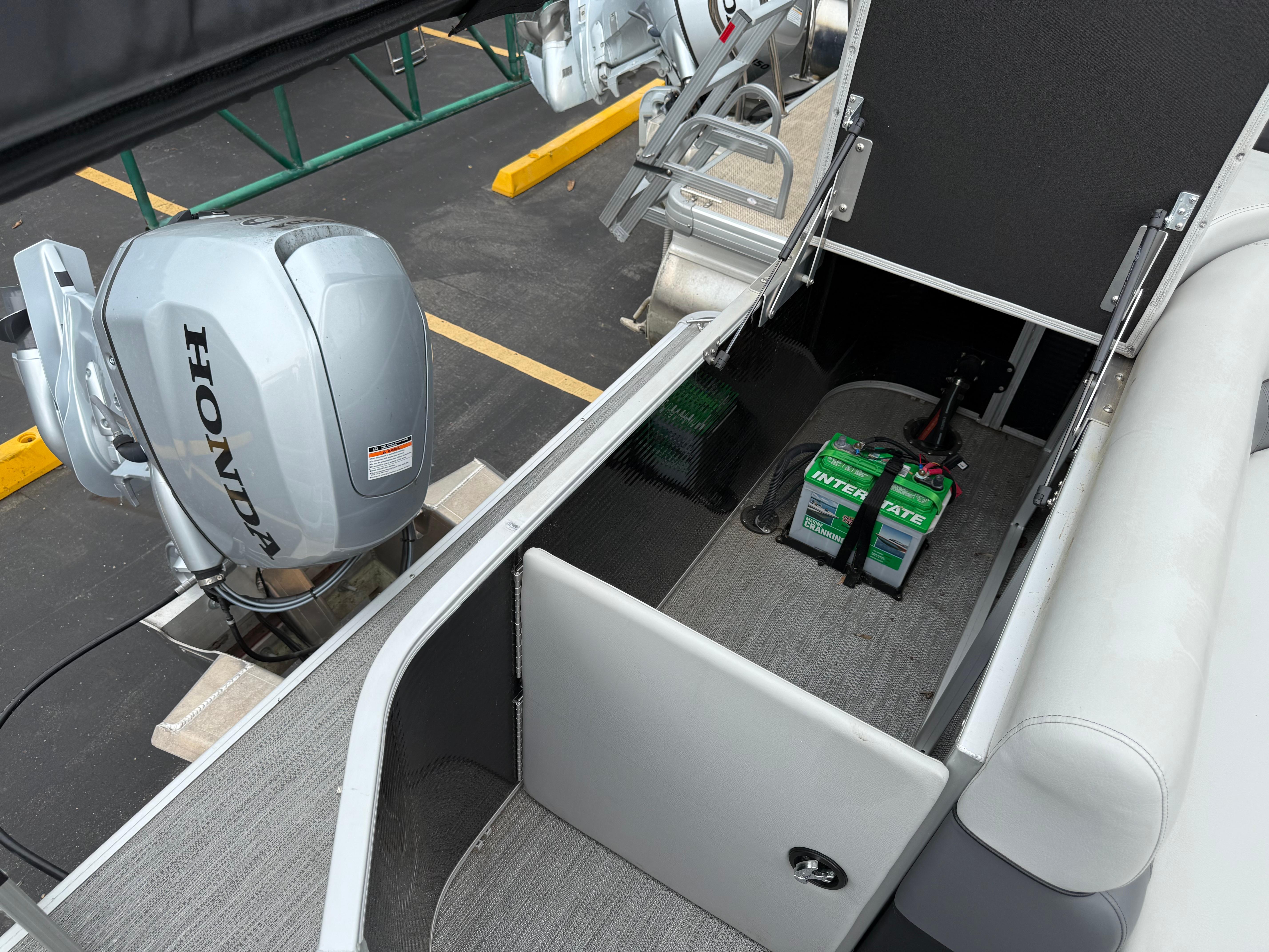 2023 Godfrey Sweetwater boat with Honda outboard motor and Interstate battery.