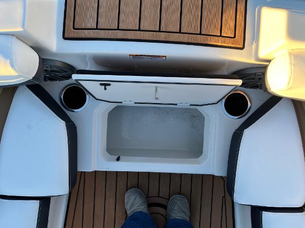 2024 Starcraft SVX 191 boat interior with storage compartment and cup holders.
