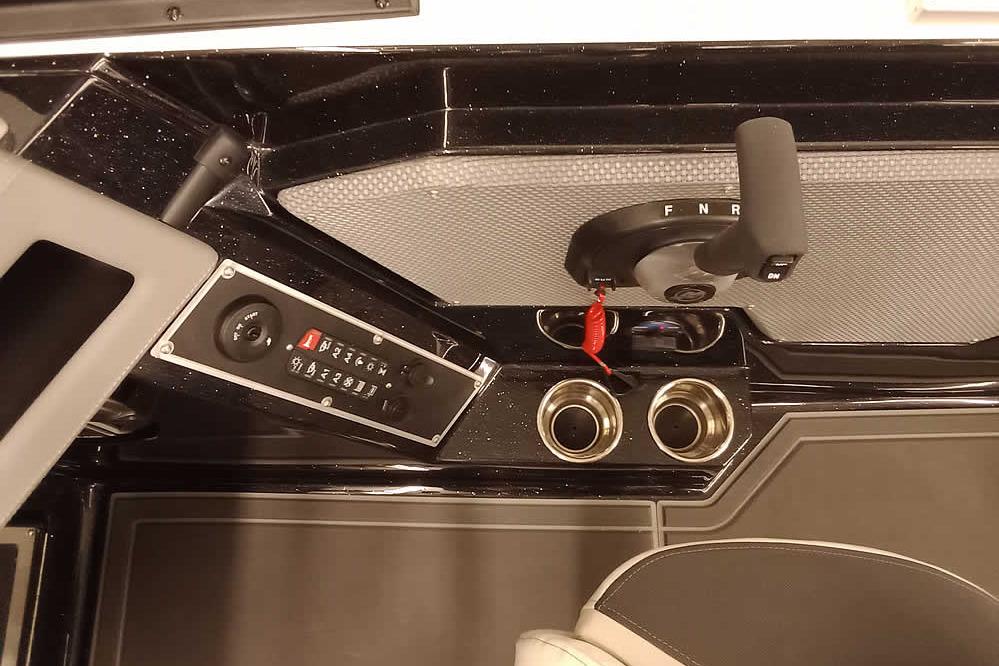 2026 Ranger 620xFS Pro boat console with controls and cup holders.