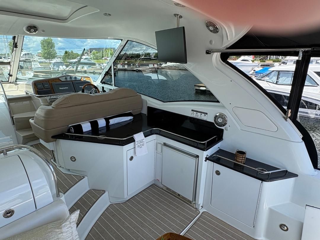 Interior of a 2011 Formula 45 with sleek features and a view of the marina.