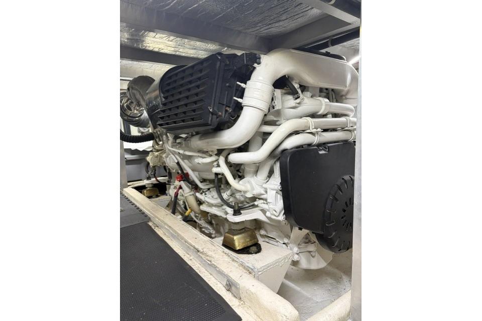 Engine of a 2007 Navigator 5100 yacht, showcasing intricate piping and components.