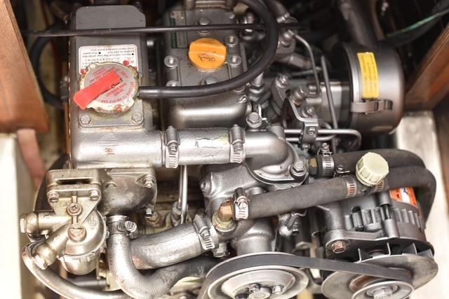 Engine of a 2001 Marlow-Hunter 320 sailboat, showcasing intricate mechanical components.