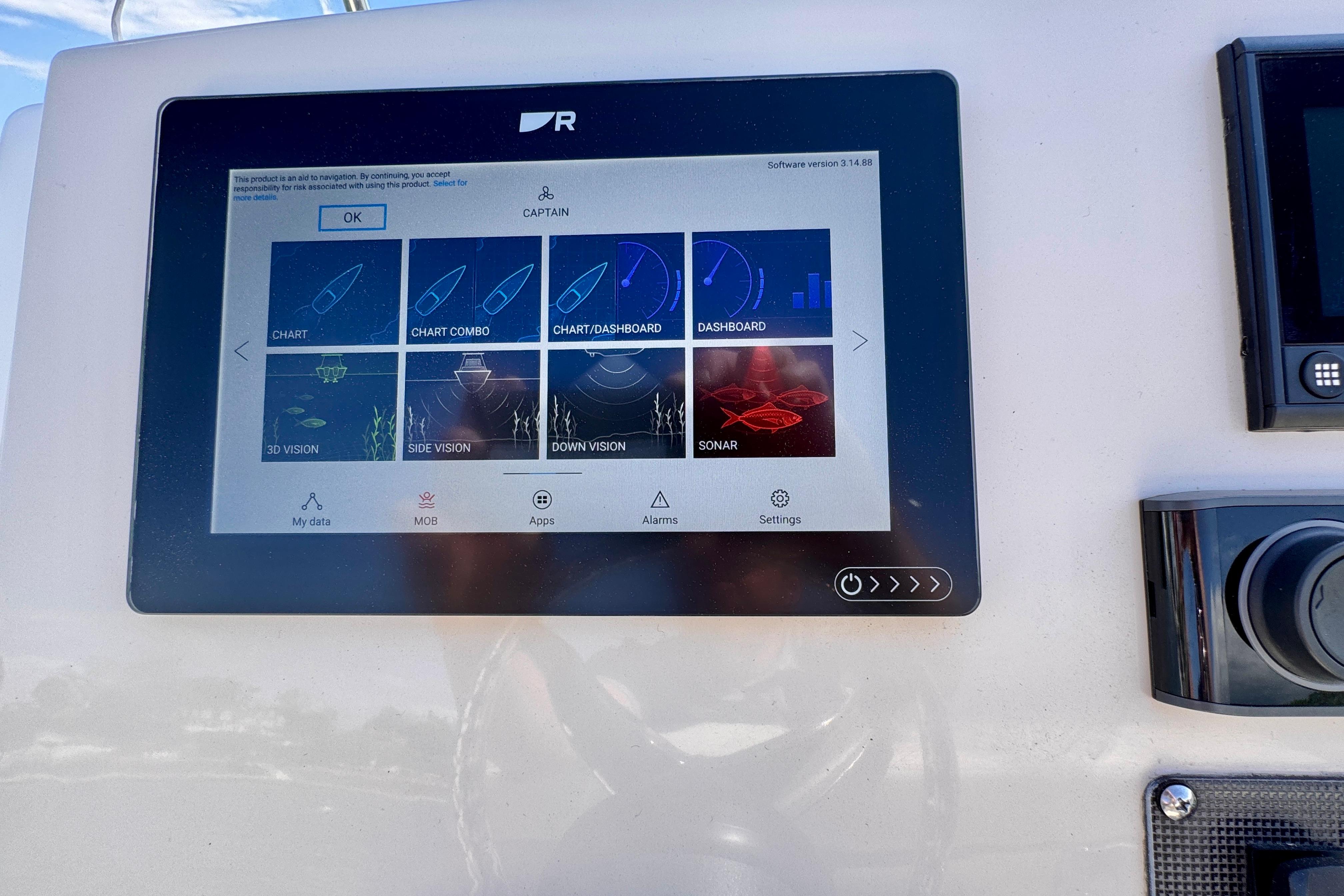 Touchscreen navigation display on 2022 Boston Whaler 220 Dauntless boat dashboard.