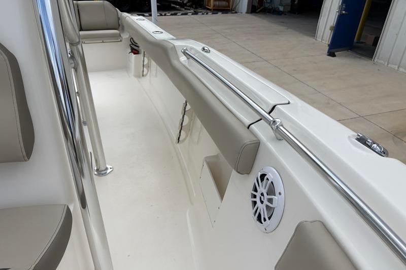 2024 Key West 239 FS boat interior with cushioned seating and speaker.