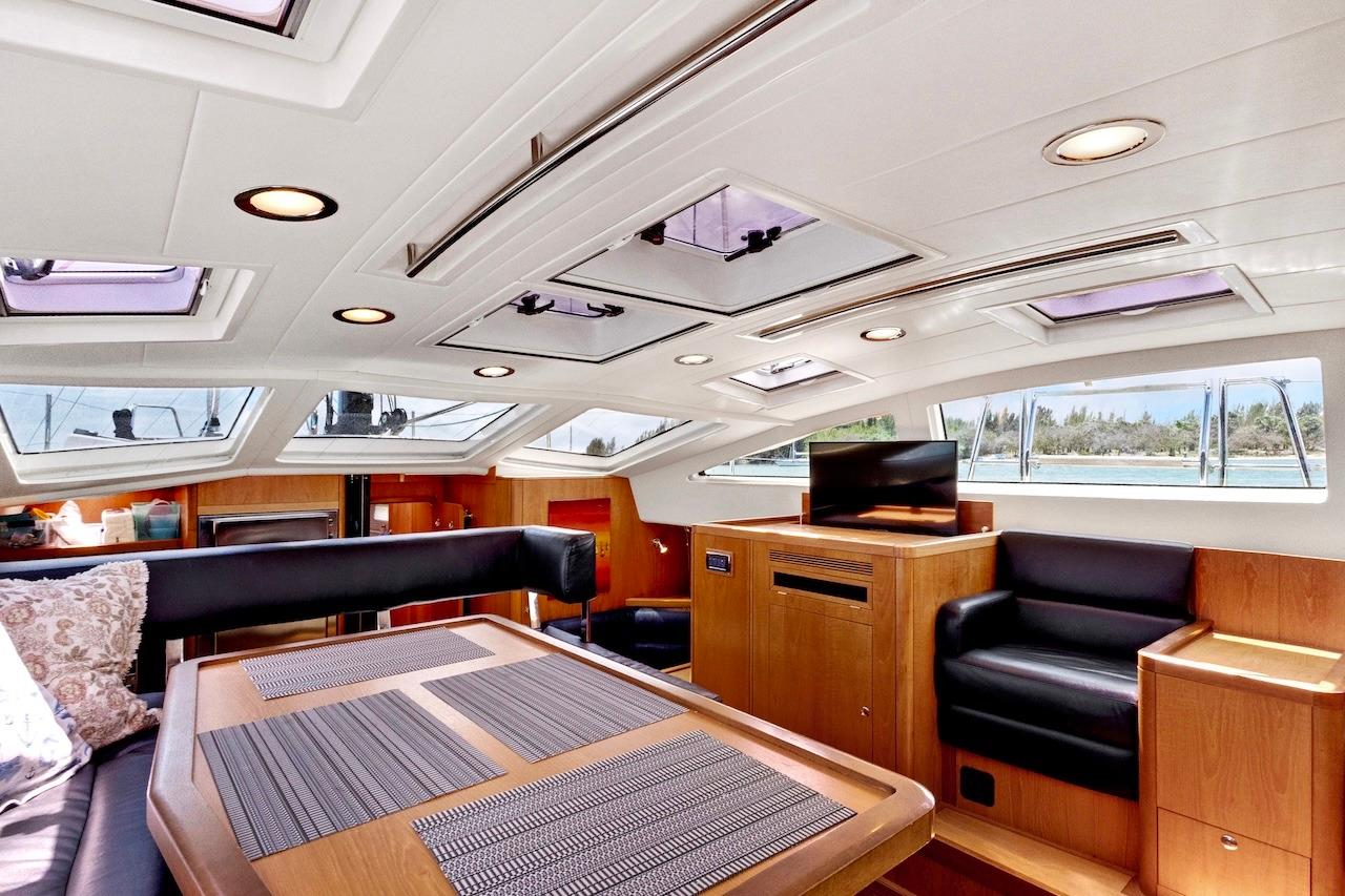 Luxurious interior of 2011 Southerly 57 RS yacht with modern seating and skylights.