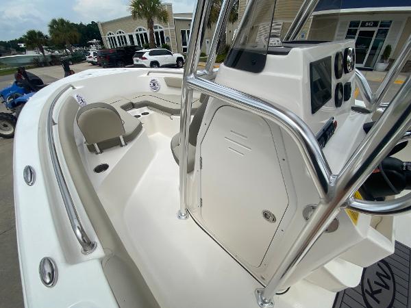 2024 Key West 203 FS boat interior with seating and console.