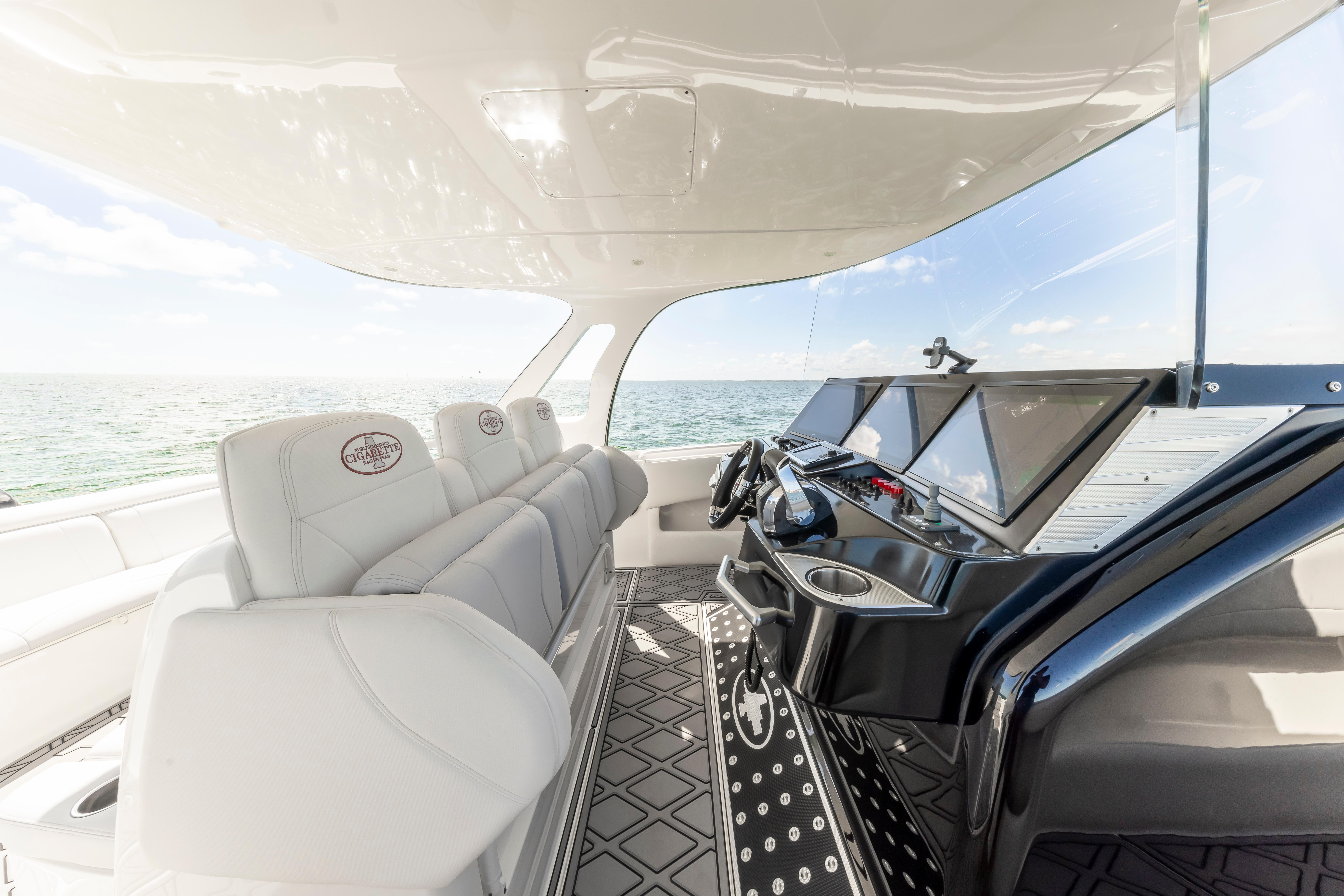 Luxurious interior of 2016 Cigarette 41 GTR boat with modern dashboard and seating.