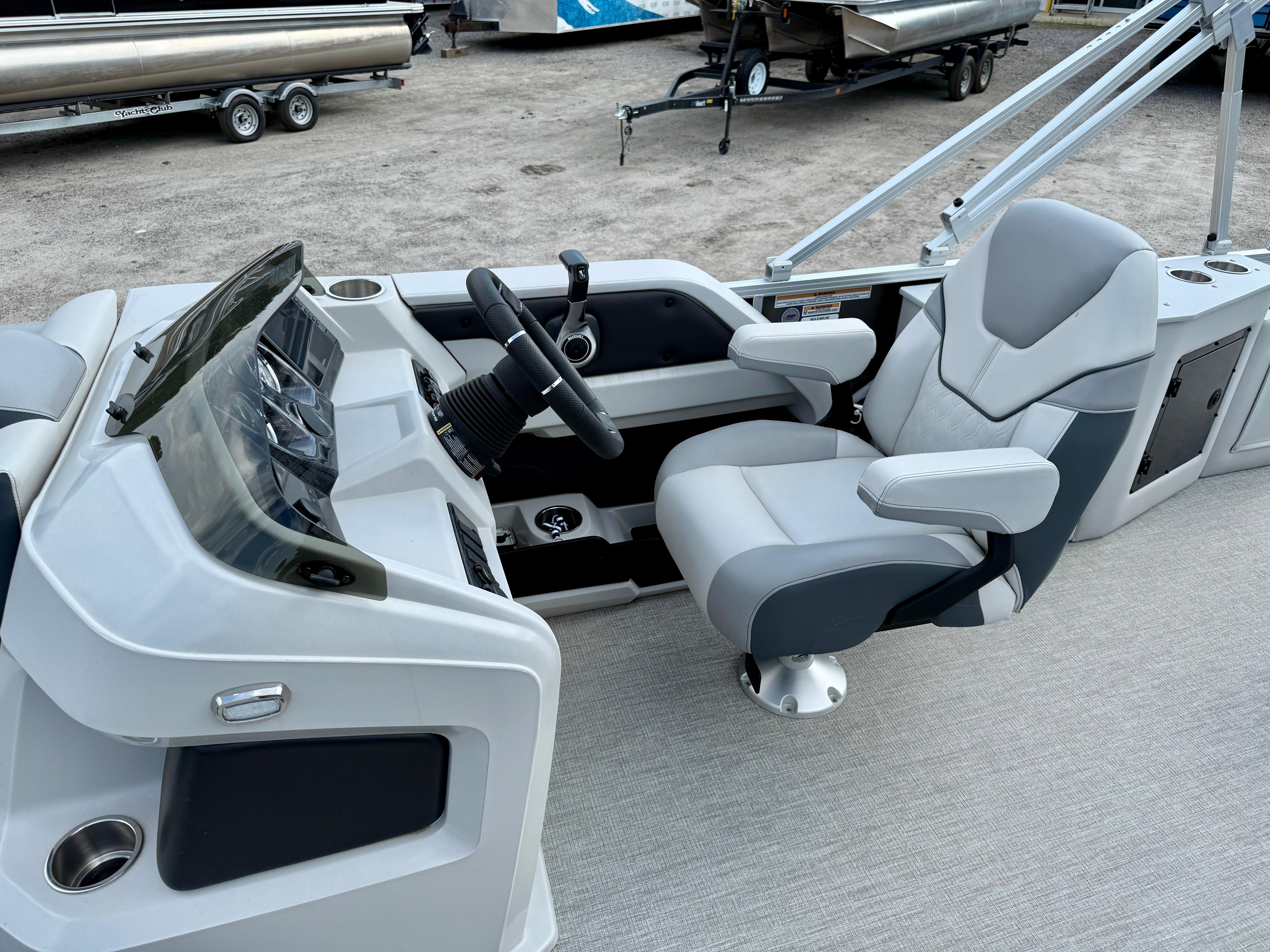 2025 Avalon LSZ Cruise Rear Bench boat interior with modern helm and comfortable captain's chair.