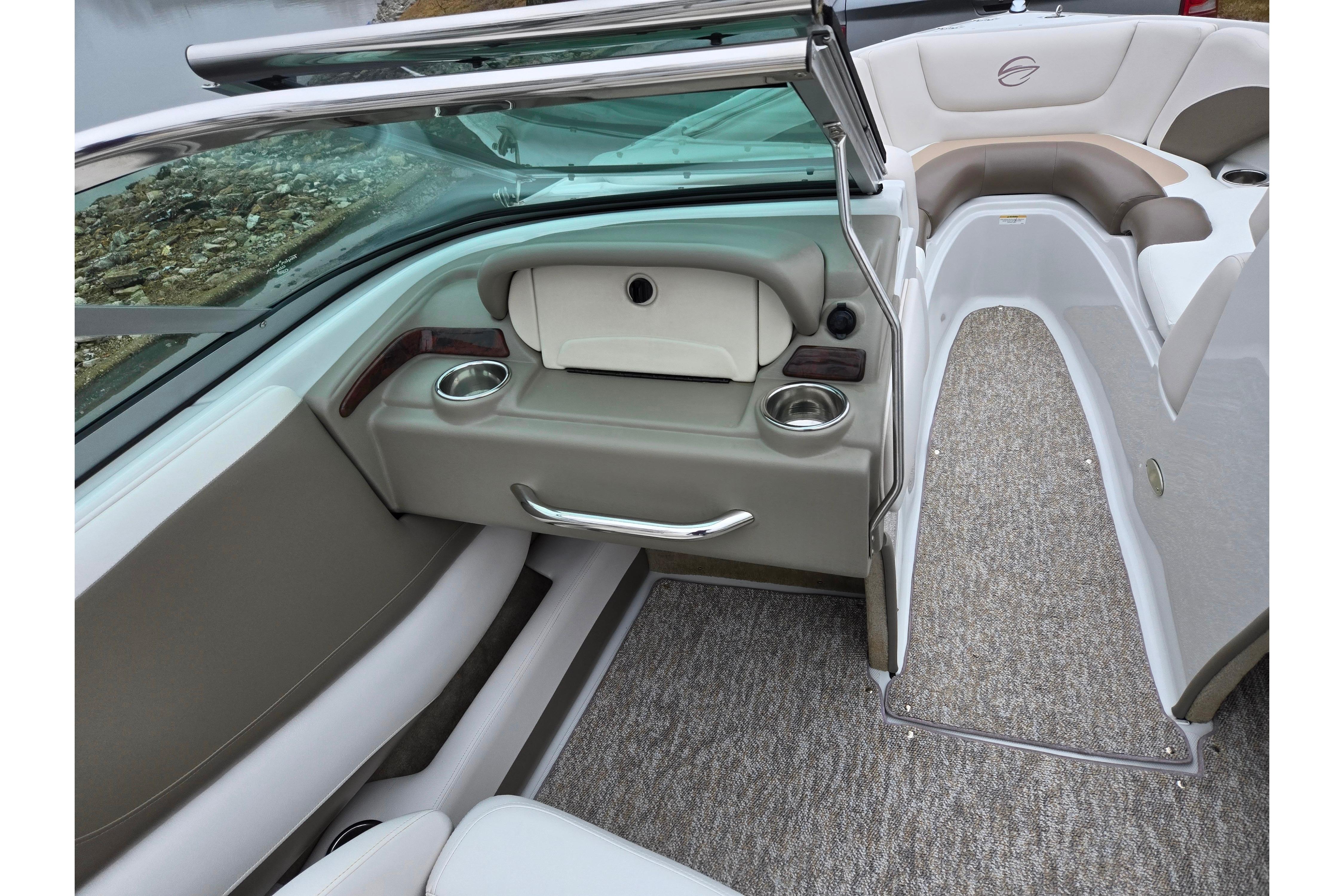 2012 Crownline 235 SS boat interior with seating and cup holders.