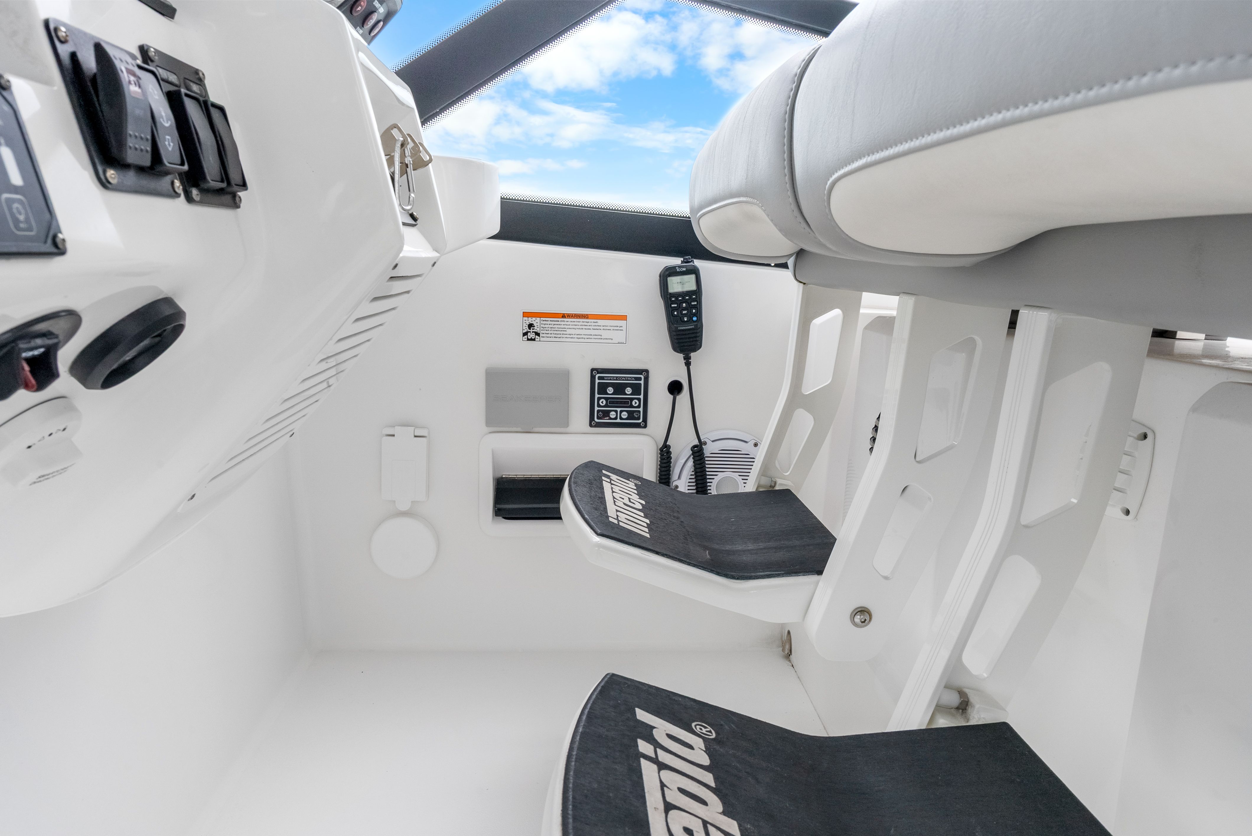 Interior of 2024 Intrepid 477 Evolution with console and seating.