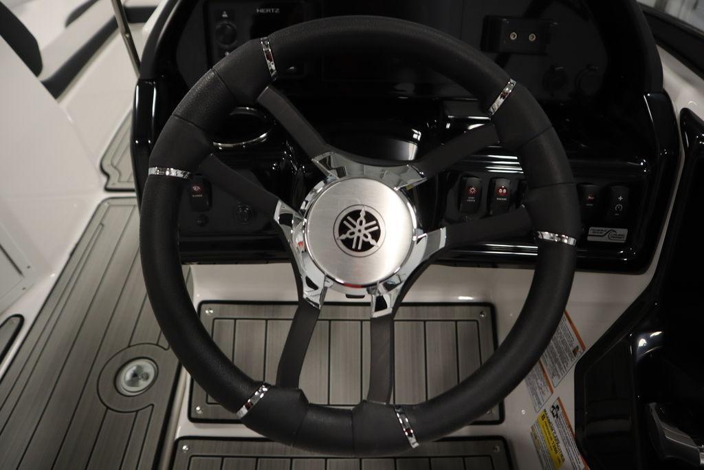 Steering wheel of 2026 Yamaha Boats 195S, featuring sleek design and modern controls.