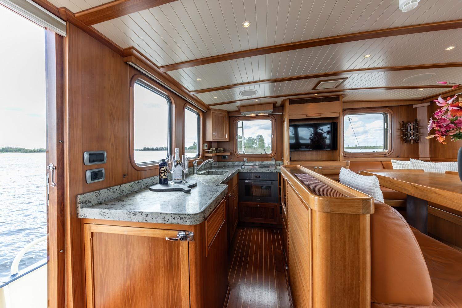 Luxurious interior of 1999 Vitters Trawler 19.90 Explorer with wood finish and modern amenities.