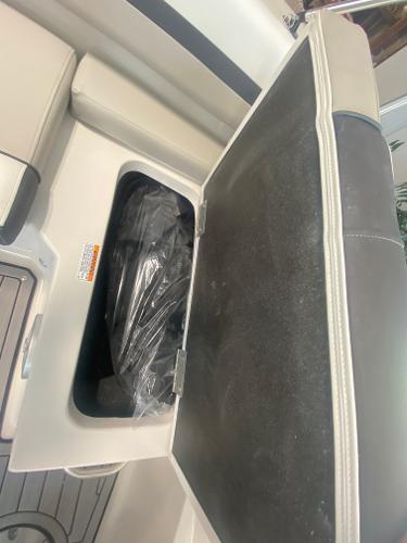 2024 Starcraft SVX 190 boat storage compartment with open lid.