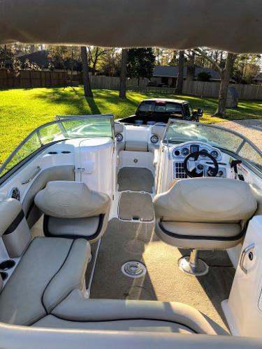 Interior view of a 2012 Godfrey Hurricane boat outdoors.
