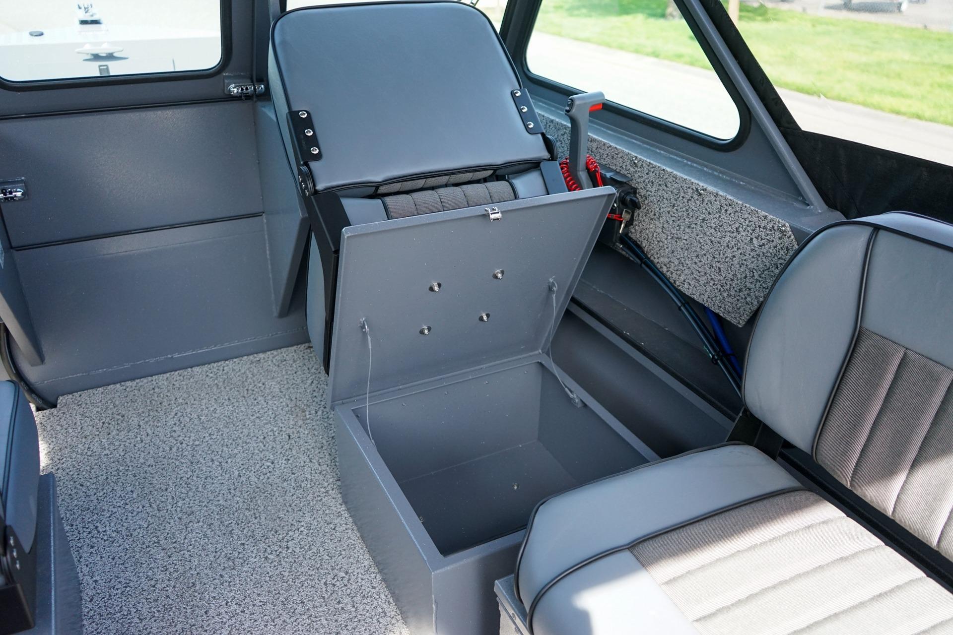 2026 Alumaweld Talon 18 interior with open storage compartment and seating.