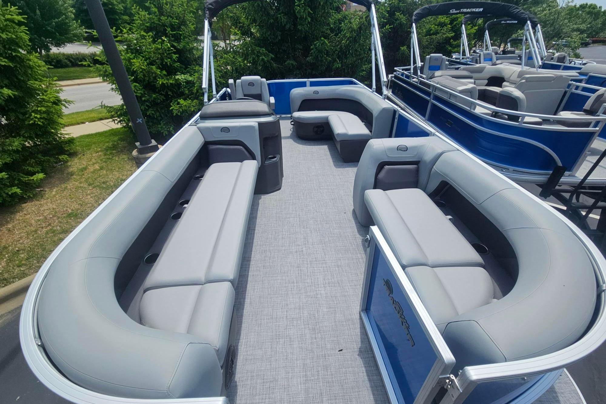 2026 Sun Tracker Party Barge 18 DLX pontoon boat with spacious seating and modern design.