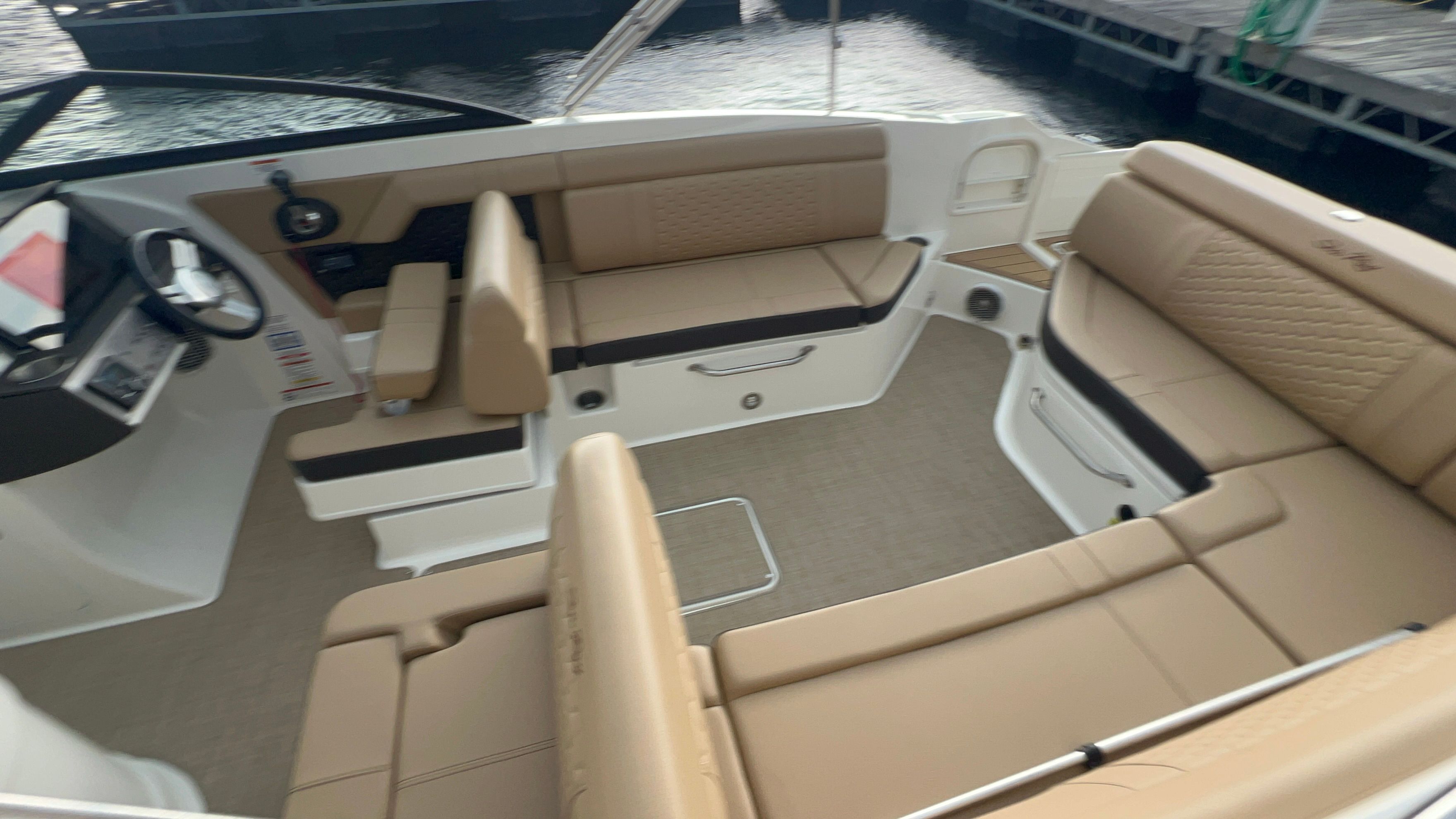 Interior of a 2018 Sea Ray SDX 270 with beige seating.