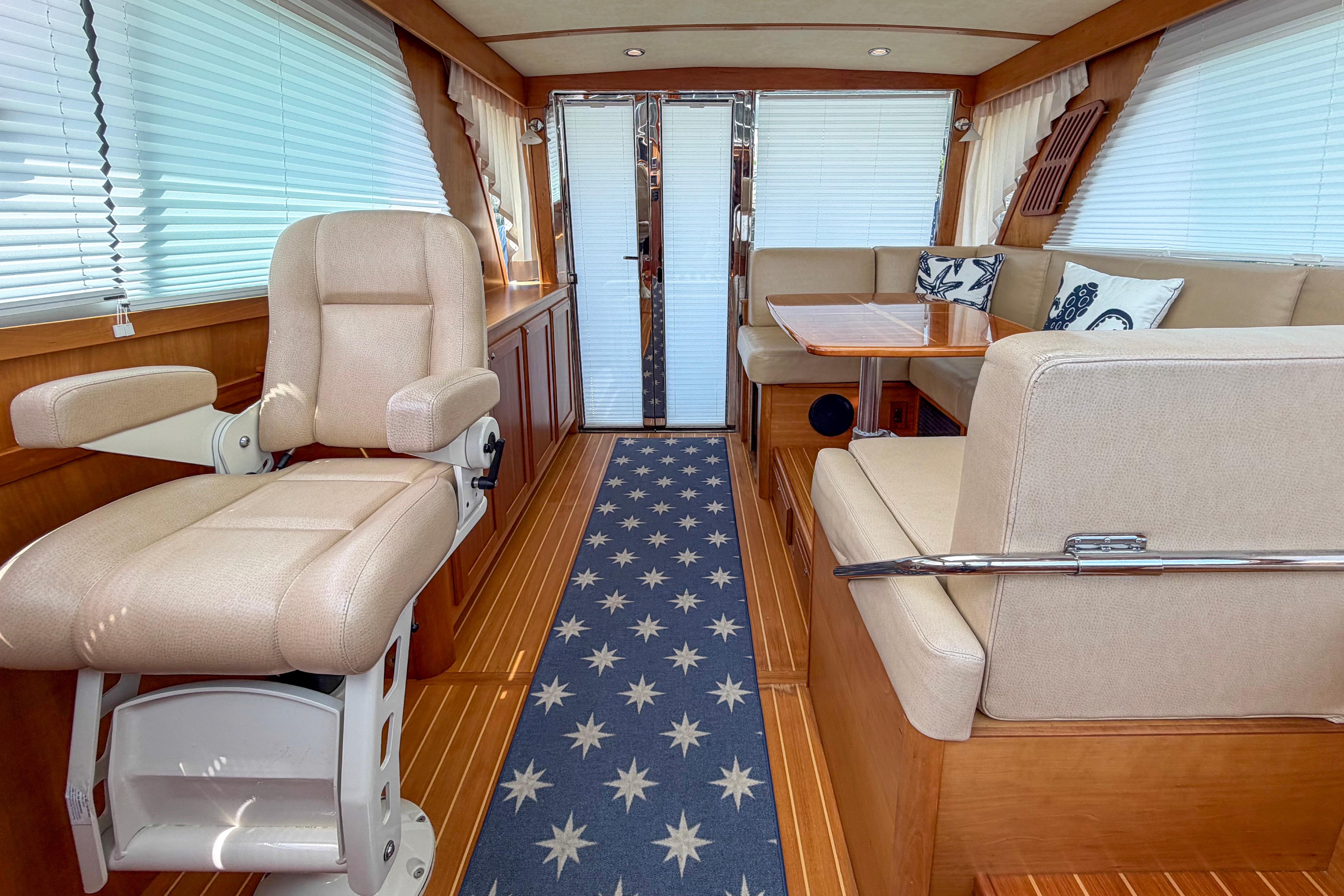 Luxurious interior of 2013 Sabre 38 Salon Express with plush seating and elegant decor.