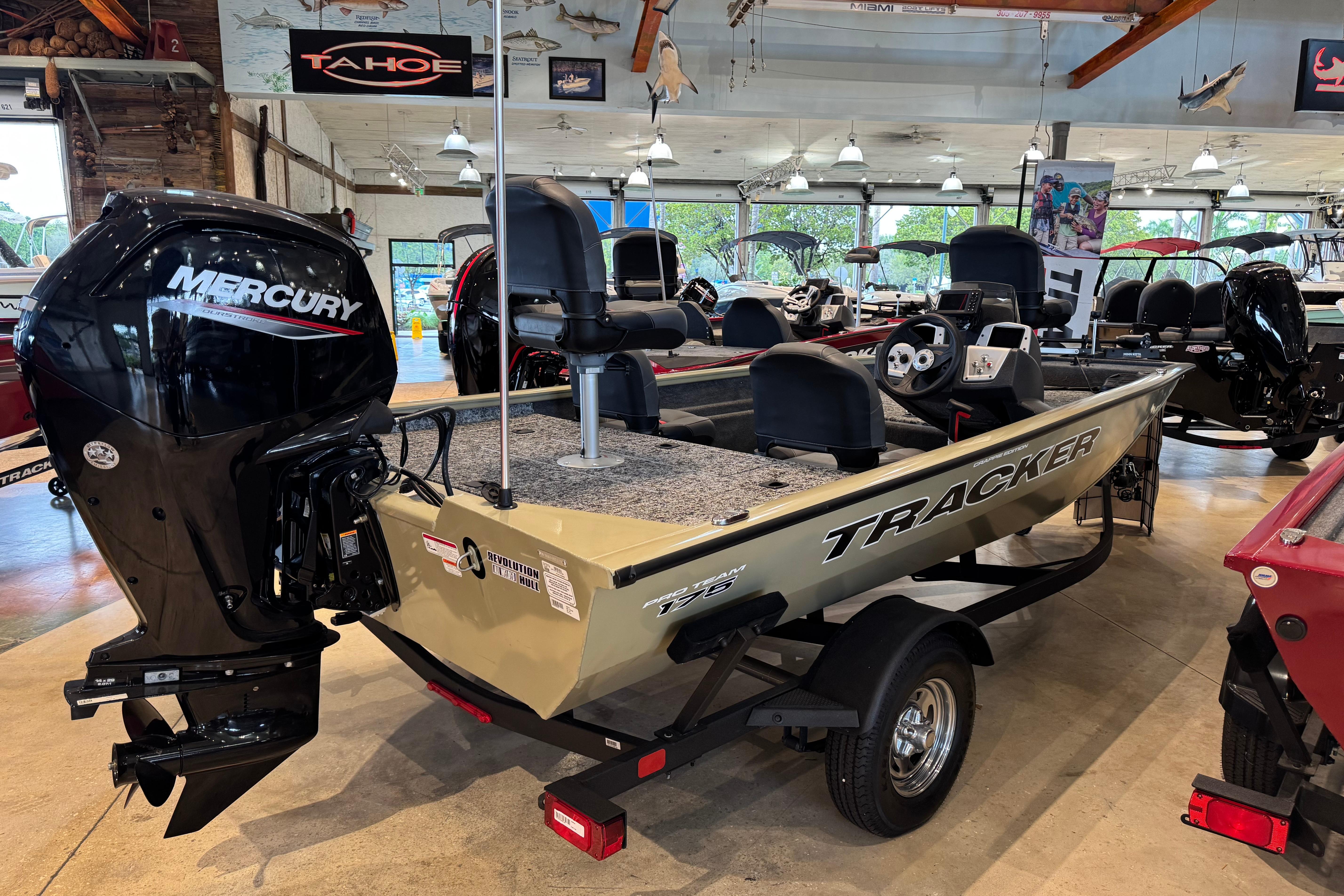 2026 Tracker Pro Team 175 Crappie Edition boat with Mercury engine in showroom.