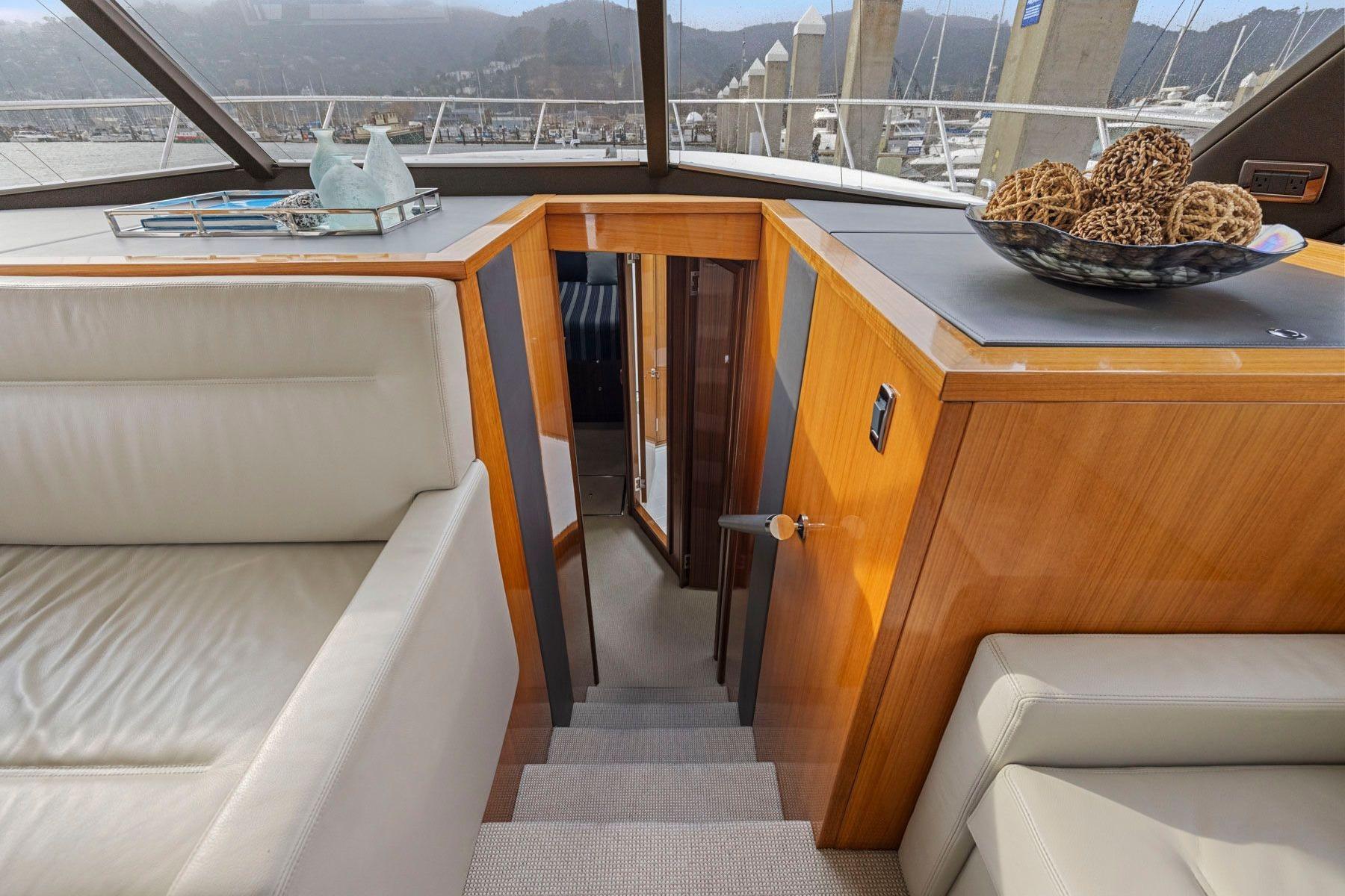 Luxurious interior of 2014 Maritimo M50 yacht with elegant wood finish and modern decor.