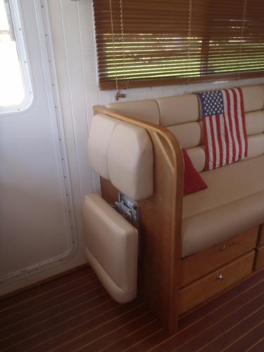 Interior of 2025 Great Harbour N40 yacht with American flag decor and wooden furnishings.