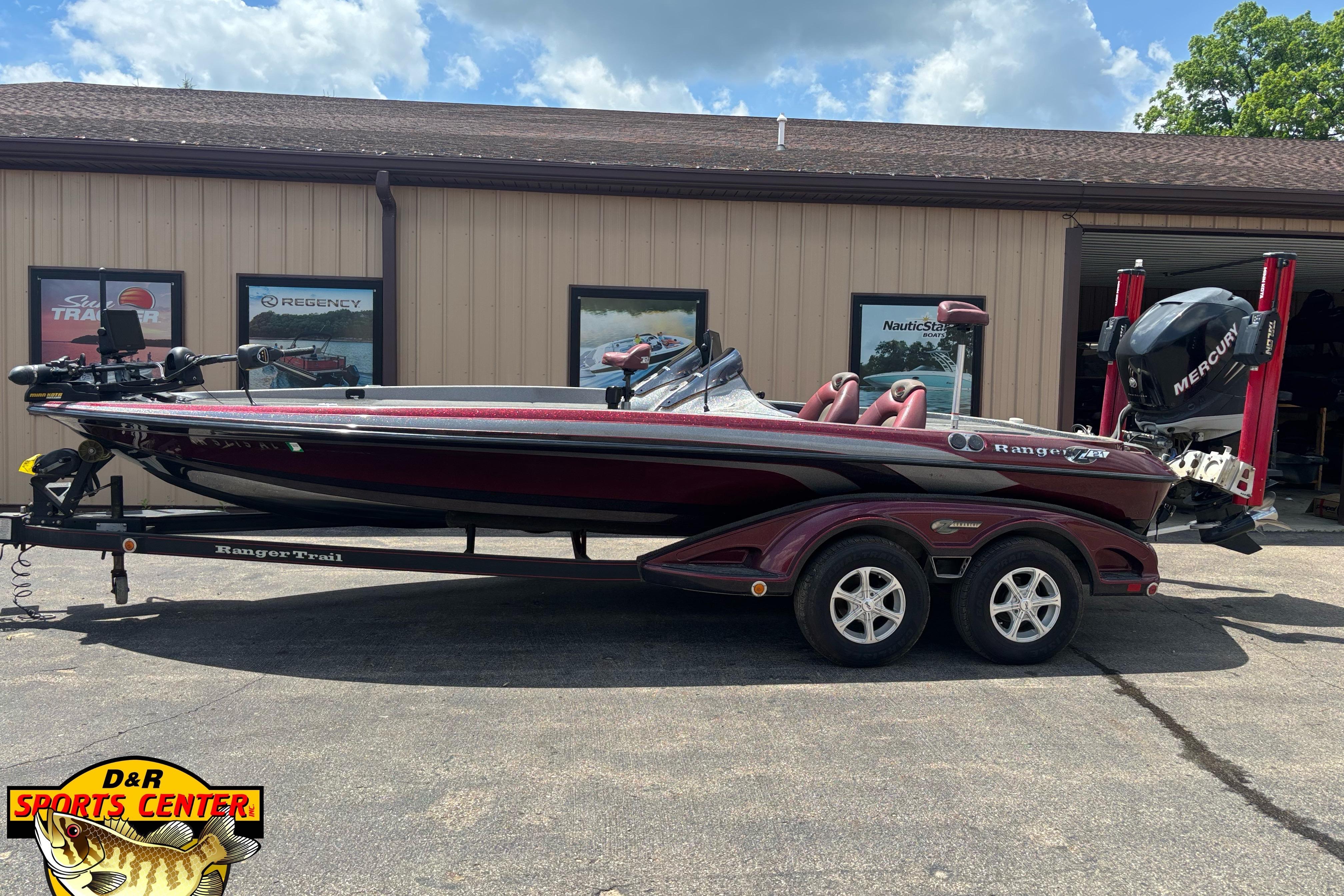2005 Ranger Z21 Comanche boat on trailer at D&R Sports Center, featuring Mercury engine.