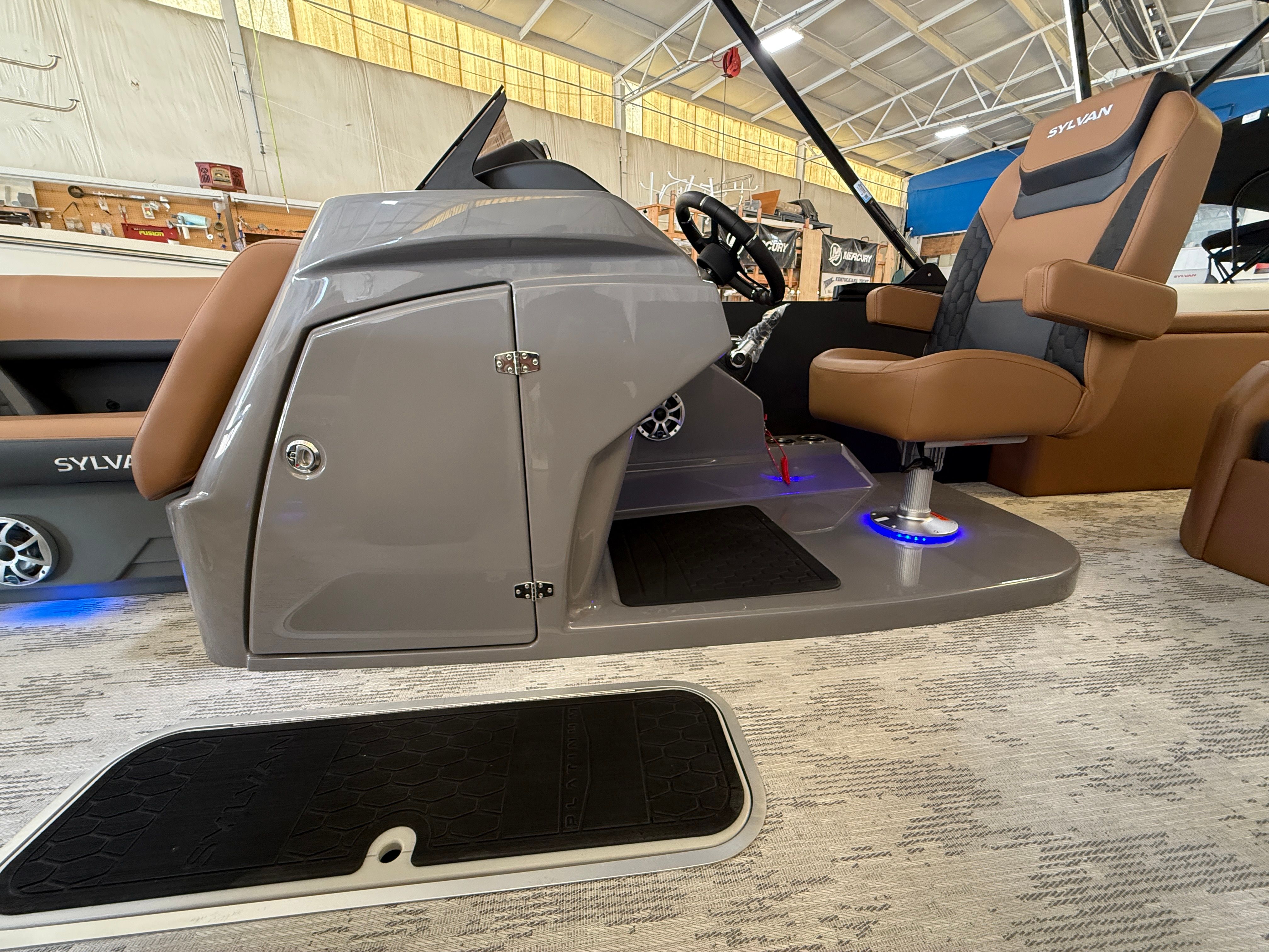 Interior view of a Sylvan L3 ULZ DH boat with modern seating and helm console.
