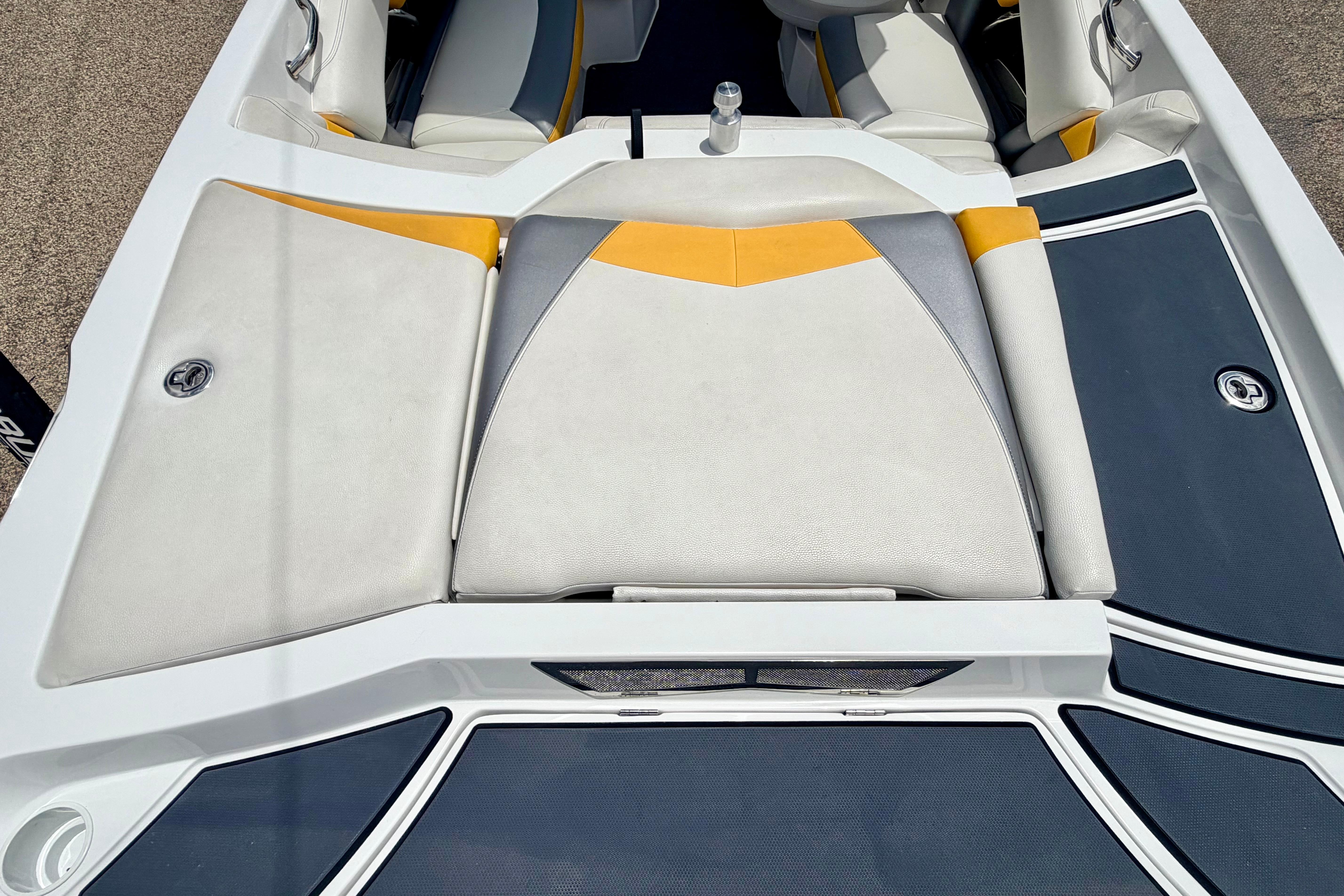 2014 Tigé R20 boat interior with white, yellow, and gray seating.