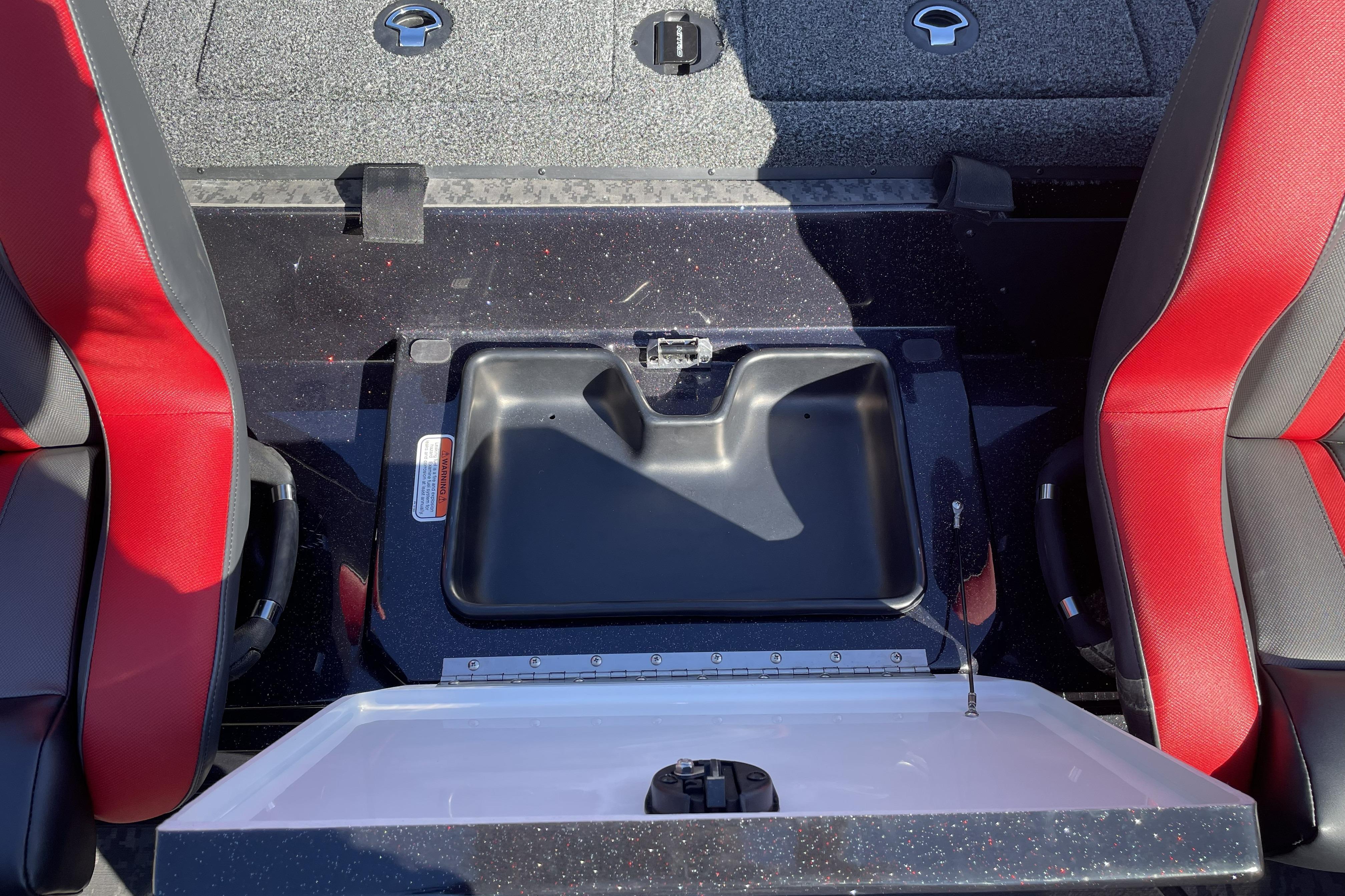 Interior of 2026 Nitro Z19 XL boat with red seats and storage compartment.