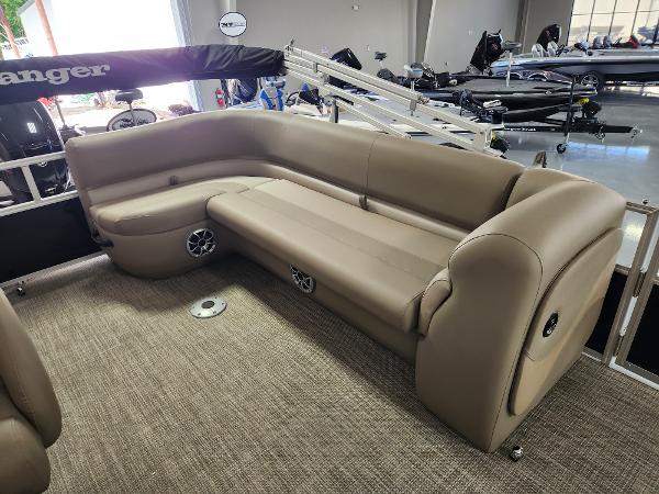 2025 Ranger 200C boat interior with beige seating and built-in speakers.