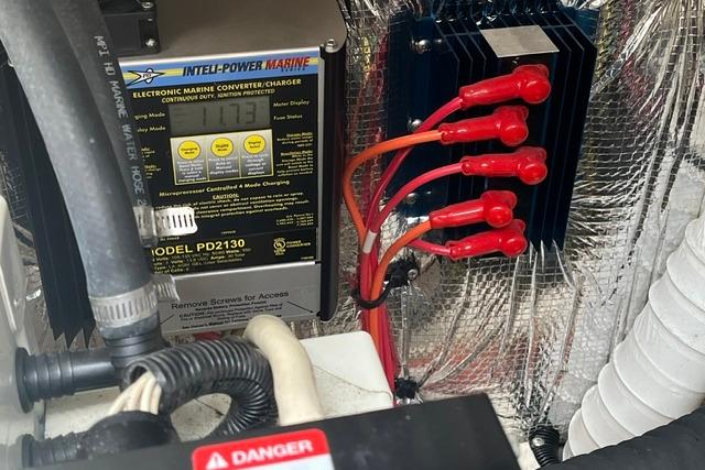 Engine compartment of a 2004 Cruisers Yachts 3372 Express with electronic marine converter.