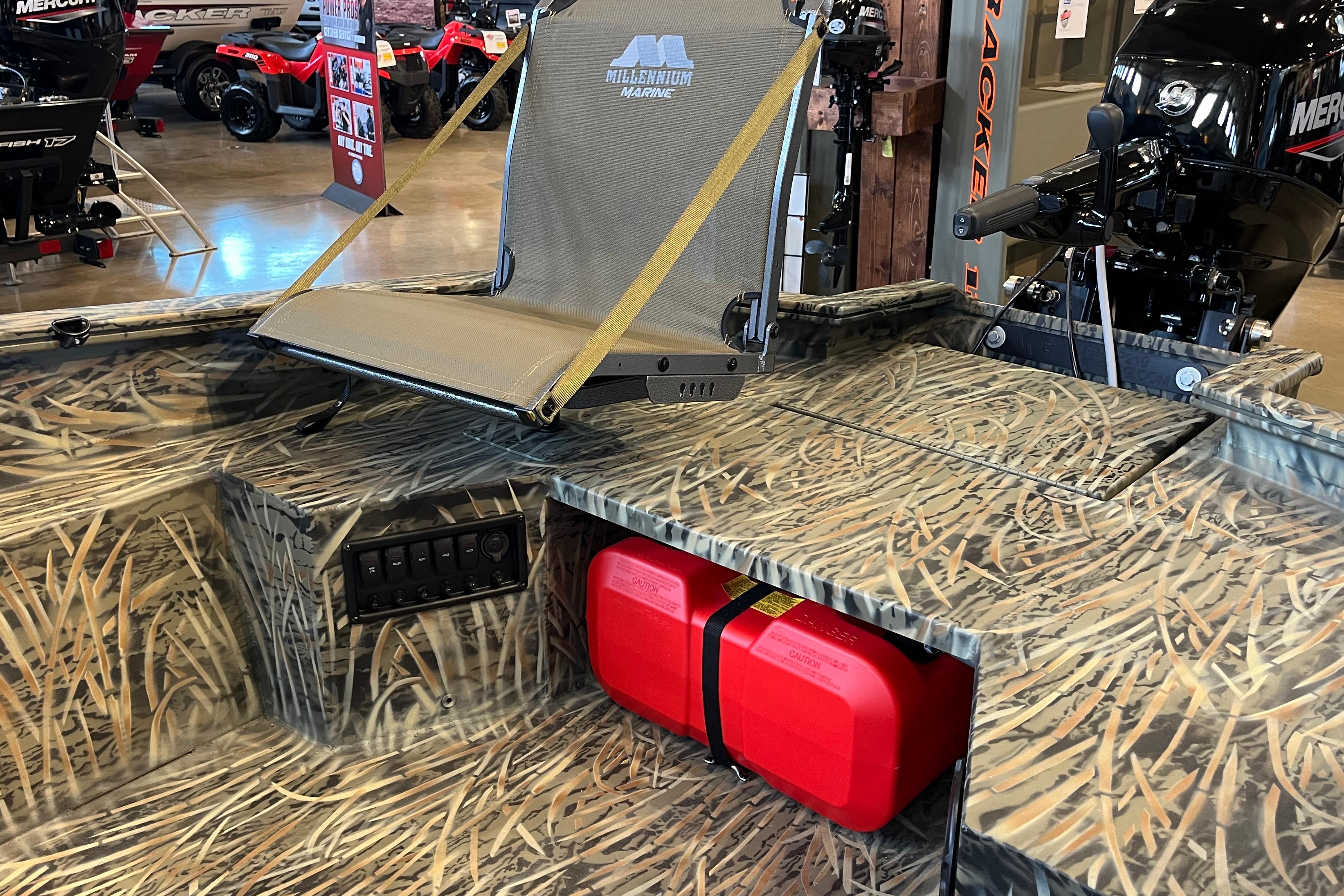 2026 Tracker Grizzly 1654 T Sportsman boat interior with camo design and mounted seat.